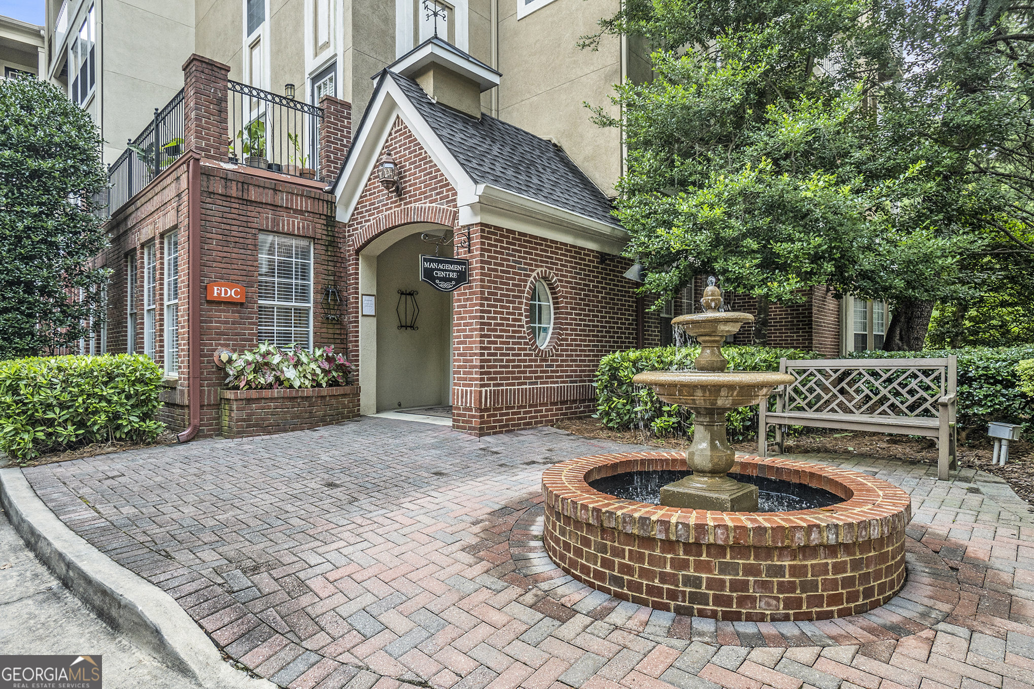This building is the one everyone wants! It is the only one with keycard entry, onsite management, a trash chute so you don't have to go to the dumpster, the package room, and all of the amenities - attached! Location is unbeatable in this Growing Area! Spacious 2BR/2BA condo in a highly sought-after, secure building with ideal split-bedroom layout-perfect for roommates, families, or remote work. Entryway features a true foyer with coat closet leading to an open concept but defined dining and living area with bonus office or reading nook. The kitchen includes ample cabinetry, stone counter-tops, a walk-in pantry, and a pass-through window-great for entertaining. The ensuites are positioned at opposite ends of the condo for maximum privacy. Both bedrooms offer large windows, newer flooring, and walk-in closets. The oversized owner's closet rivals those found in most single-family homes. The community amenities are well-kept and updated. These include a pool, tennis courts, walking trails, renovated social room, fitness center, theater, and package room. The condo has 2 deeded, side-by-side garage parking spots in an easy to access location.