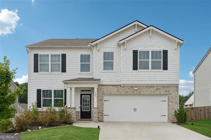 Welcome to 347 Etowah Parkway, a well-appointed 5-bedroom, 3-bath Hanover floor plan residence located in the highly desirable Etowah Preserve community in Dawsonville, GA. This home features an open-concept main level with luxury vinyl plank flooring, a spacious living area with a custom stacked-stone fireplace, and a modern kitchen equipped with granite countertops, stainless steel appliances, a large island, and a walk-in pantry. A guest bedroom and full bath on the main level offer added versatility, while upstairs you'll find a generous loft, three secondary bedrooms, and a serene primary suite with dual vanities, soaking tub, separate shower, and an oversized walk-in closet. Residents of Etowah Preserve enjoy access to a wide array of professionally maintained amenities, including a junior Olympic-size swimming pool, splash pad, two full-size tennis courts, a clubhouse, sidewalks, and a playground - all surrounded by scenic green spaces and natural views. The neighborhood's thoughtful design supports a comfortable, active lifestyle with spaces for relaxation, recreation, and connection. This home offers convenient access to GA-400, local parks, shopping, dining, and the North Georgia Premium Outlets. Whether you're seeking comfort, convenience, or a strong sense of community, this is a move-in ready opportunity that blends modern design with exceptional neighborhood features.