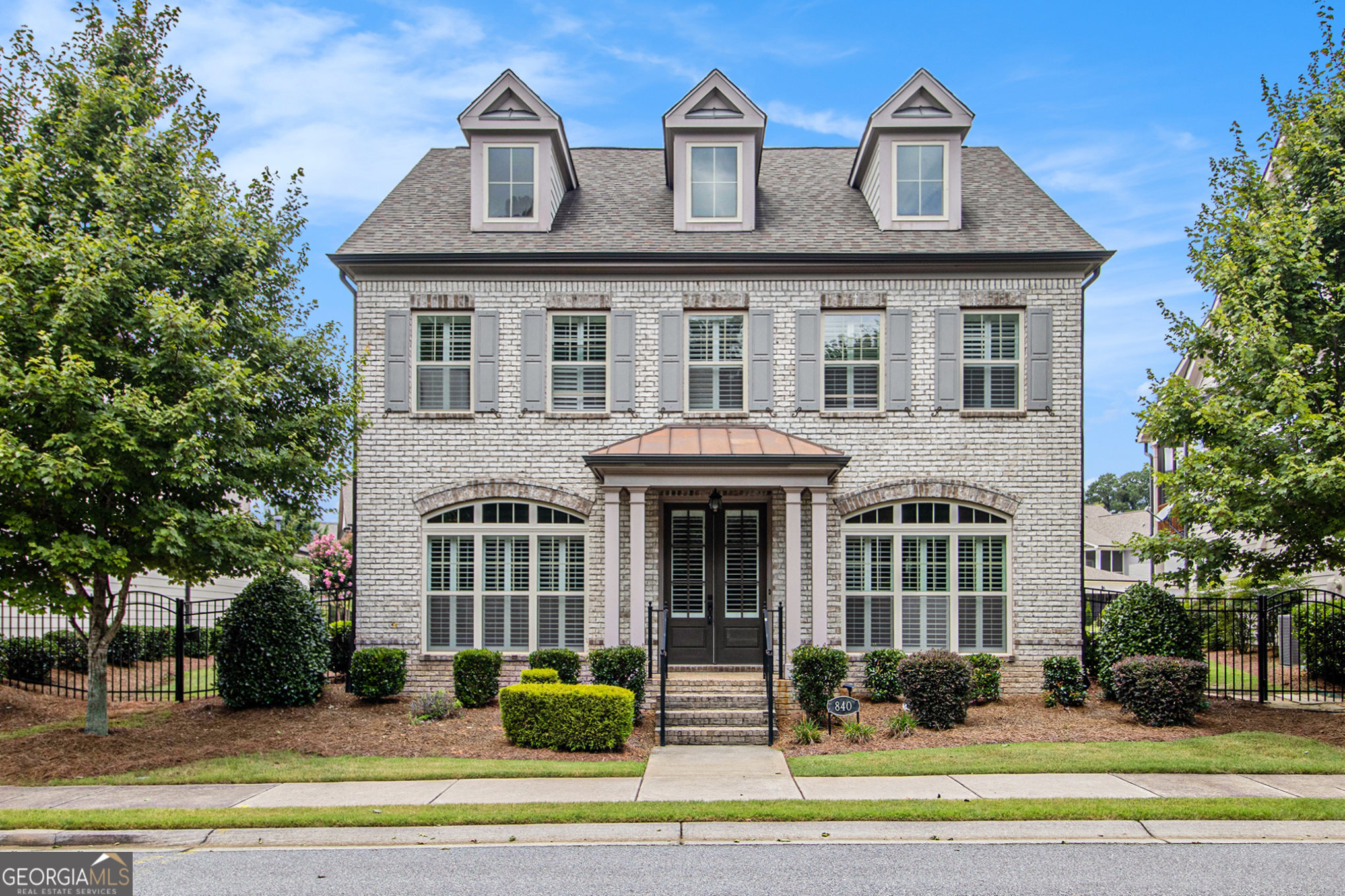 Don't miss this rare opportunity in one of the area's most desirable locations! Enjoy an Alpharetta address with the benefit of low Forsyth County taxes, highly rated schools, and a gated swim/tennis community. Perfectly positioned just minutes from Avalon, Halcyon, the new GA-400 access points, Big Creek Greenway, and the upcoming Gathering development/arena for endless dining, shopping, and recreation options. This home features one of the neighborhood's most generous floorplans with 4 bedrooms and 3.5 baths. The main level includes a luxurious owner's suite with a spa-inspired bath and two custom walk-in closets. Upstairs offers three additional bedrooms, two full baths, a flexible loft area, and a large unfinished bonus space ideal for a playroom, gym, or media room.
