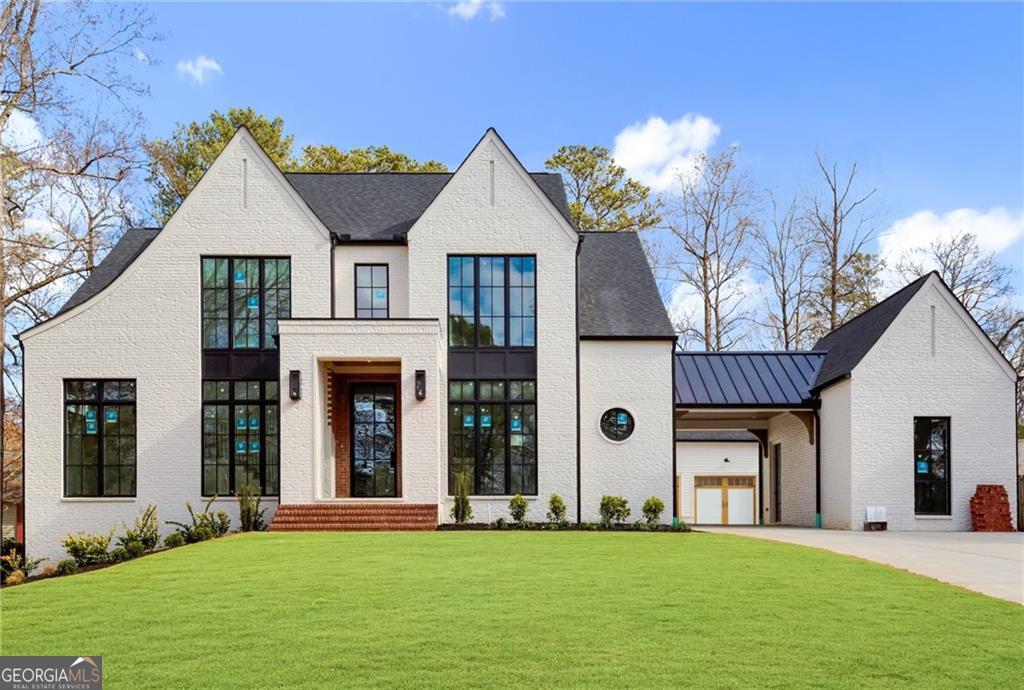 Nestled in the highly sought-after Indian Hills community, this exquisite 4-bedroom, 4.5-bath home with a 3-car garage and 11ft ceilings on the main floor is the epitome of refined luxury and timeless elegance. Situated on an expansive lot, this custom-designed residence promises an exceptional living experience from the moment you step through the grand iron and glass front door. The family room is a true masterpiece, combining both functionality and aesthetics, with its centerpiece being a stunning fireplace that adds a touch of sophistication to any gathering. The chefCOs kitchen is a culinary dream, outfitted with high-end appliances, premium fixtures, and an open layout that flows seamlessly into the dining and living areas. Adjacent to the kitchen, youCOll find a well-appointed scullery, offering a tucked-away space for additional meal preparation and storageCoperfect for entertaining. The main level features a spacious vaulted ownerCOs suite, serving as a private sanctuary complete with a spa-inspired bathroom, dual vanities, a large walk-in shower, and a soaking tub. Upstairs, discover a second primary suite along with two additional bedrooms, each offering generous closet space and private ensuite baths. Step outside to the expansive, walk-out backyardCoa true entertainerCOs paradise. Enjoy cooler evenings on the large patio with an outdoor fireplace, and take advantage of the ample space for a future pool. Ideally located within the top-rated Walton school district, this home provides easy access to upscale dining, boutique shopping, and vibrant entertainment. Experience the perfect blend of luxury and comfort in this one-of-a-kind home. Home is 30 days from completion.