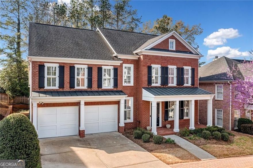 Nestled in a picturesque John Wieland community just moments from Roswell Square, this beautiful brick home blends timeless elegance with modern updates in a truly unbeatable location. Stroll to festivals, boutique shopping, top-rated dining, and the scenic trails of the Chattahoochee Nature Park.  All just steps from your front door! Inside, a bright and open floorplan welcomes you with gleaming luxury vinyl plank, designer lighting, and fresh paint throughout. The spacious primary on main features new carpet and a vaulted master bath (renovated in 2025), offering a serene retreat, while three additional bedrooms upstairs provide plenty of space for family and guests. A versatile bonus room on the main level is perfect for a home office or study. The two-story great room is filled with natural light, flowing seamlessly into a crisp, white kitchen with a full suite of appliances, breakfast bar, and cozy breakfast nook. Plantation shutters and thoughtfully updated guest baths add to the home's polished feel. Outside, enjoy a private patio with a gas line already installed for the grill and level, low-maintenance yard, all maintained by the HOA. Including mowing, edging, pruning, and even fresh mulch! With move-in-ready finishes, this home is truly turn-key. Tucked in a fabulous cul-de-sac neighborhood with sidewalks, street lamps, and top-rated schools, this home offers the best of Historic Roswell living.    Classic charm, modern convenience, and an unbeatable location. Welcome home!