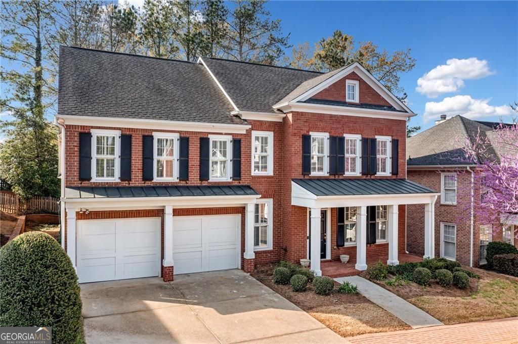 Nestled in a picturesque John Wieland community just moments from Roswell Square, this beautiful brick home blends timeless elegance with modern updates in a truly unbeatable location. Stroll to festivals, boutique shopping, top-rated dining, and the scenic trails of the Chattahoochee Nature Park. All just steps from your front door! Inside, a bright and open floorplan welcomes you with gleaming luxury vinyl plank, designer lighting, and fresh paint throughout. The spacious primary on main features new carpet and a vaulted master bath (renovated in 2025), offering a serene retreat, while three additional bedrooms upstairs provide plenty of space for family and guests. A versatile bonus room on the main level is perfect for a home office or study. The two-story great room is filled with natural light, flowing seamlessly into a crisp, white kitchen with a full suite of appliances, breakfast bar, and cozy breakfast nook. Plantation shutters and thoughtfully updated guest baths add to the home's polished feel. Outside, enjoy a private patio with a gas line already installed for the grill and level, low-maintenance yard, all maintained by the HOA. Including mowing, edging, pruning, and even fresh mulch! With move-in-ready finishes, this home is truly turn-key. Tucked in a fabulous cul-de-sac neighborhood with sidewalks, street lamps, and top-rated schools, this home offers the best of Historic Roswell living. Classic charm, modern convenience, and an unbeatable location. Welcome home!
