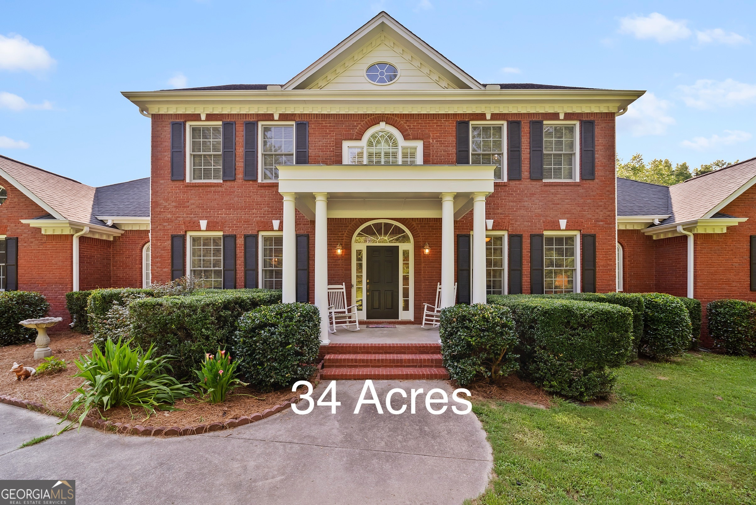 Classic Southern charm meets elegant equestrian living on this 34 acre estate. This beautifully crafted, traditional four-sided brick home offers 3575 sq. ft. of comfortable, functional living space, featuring 4 bedrooms - including a spacious primary suite on the main level - 4 full baths, and a half bath. Thoughtfully designed for both everyday living and entertaining, the home is surrounded by gently rolling pastureland in a peaceful country setting. Equestrians and hobby farmers alike will appreciate the well appointed 5-stall barn, complete with a wide center aisle, tack room, wash rack, and upstairs hayloft. Four large pastures are already in place, with plenty of room to add more. There's also a creek along the rear of the property, and a sand arena that's perfect for training or recreation. Tucked among other large-acreage properties, this idyllic farm offers the best of both worlds - rural tranquility, but just minutes from the charm of Olde Town Conyers and with easy access to Atlanta via I 20. Whether you're dreaming of a quiet countryside retreat, a boutique training facility, or a fully functional hobby farm with access to city convenience, this property checks all the boxes.