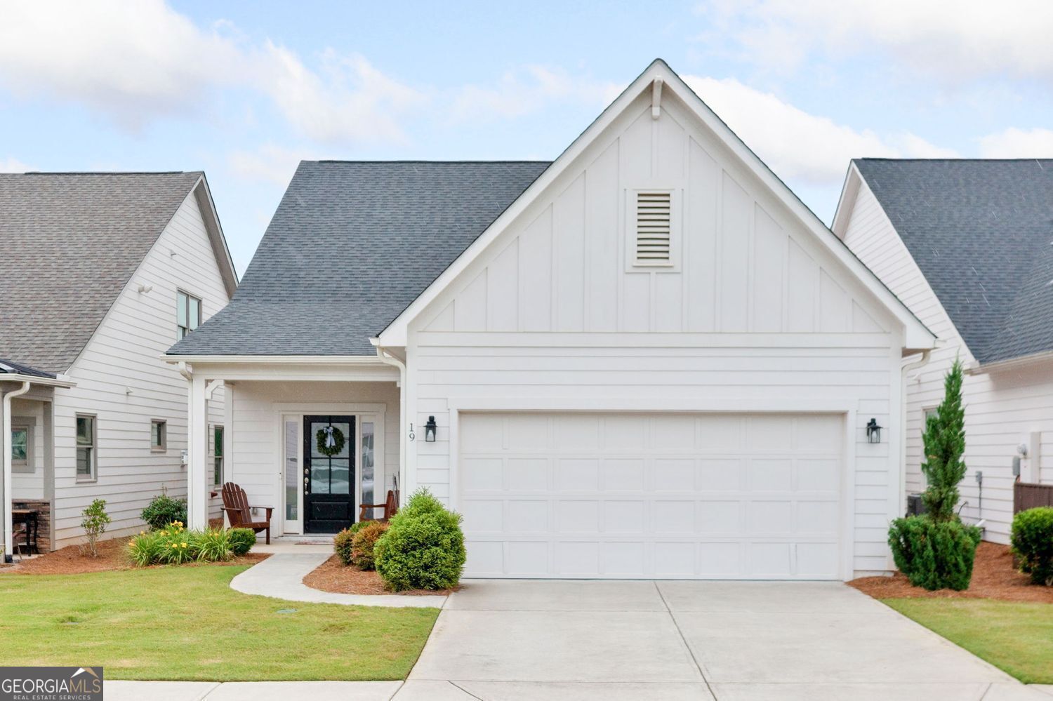 Welcome to this charming three-bedroom, three-bathroom home with a loft in a prestigious senior community. It boasts stunning views of the North Georgia mountains and many upgrades including LVP throughout home. The main level features an open living area with a cozy gas fireplace. The kitchen shines with quartz countertops, a five-burner gas range, a vent hood, and a microdrawer. Soft-close drawers and cabinet pull-outs add convenience. You'll also find two bedrooms and two bathrooms, including a spacious primary suite. The primary suite features a tiled shower with frameless glass and a double vanity with granite countertops. Upstairs, there's a roomy loft, an extra bedroom, and a full bath. The main level has a laundry room with added cabinetry for storage. Enjoy your morning coffee or evening breeze on the screened porch overlooking the fenced yard. The oversized two-car garage has epoxy flooring for a clean, durable finish. Step inside to experience the vibrant community. Explore the walking trails, play pickleball, or fish at the lake. The community also features a pool, a dog park, a garden, and a clubhouse with arts and crafts, a demonstration kitchen, and a fitness center. Unwind in the yoga room, outdoor kitchen, or gather around the firepit. The monthly HOA fee covers access to these amenities, along with lawn maintenance, trash, recycling, internet, and cable. Enjoy a lifestyle of ease at Grandview at Gateway.