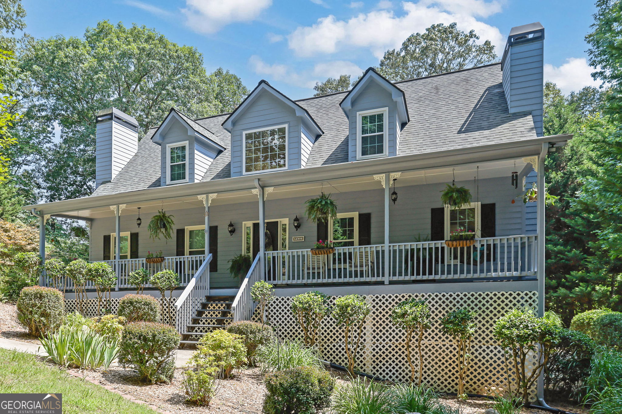 Welcome to 422 Gold Crest Drive | Dahlonega, GA. Elegantly, renovated Mountain Retreat with Custom Finishes and Scenic Serenity. Bright and sunny throughout, this beautifully updated home combines modern luxury with serene, private living on 2.64 acres-just minutes from the historic town square. Step inside to discover a stunning, fully renovated kitchen featuring custom cabinets with soft-close drawers, a sliding spice rack drawer, sliding pan drawer, lazy Susan, under-cabinet lighting, sleek granite countertops, new stainless steel appliances, gas range/oven and a farmhouse sink - truly a chef's dream kitchen! Fresh paint inside and out gives the home a crisp, inviting feel, new luxury flooring flows throughout, complemented by renovated bathrooms that showcase matching high-end finishes. The MAIN LEVEL Owner's Suite provides an elegant fireplace to keep you warm on winter nights. The primary bath offers a spa-like retreat with a step-in tiled shower and pebble flooring, double mirrored medicine cabinets, and a heated bidet for ultimate comfort. And, a spacious custom walk-in closet to house your clothes, shoes, hats, purses etc. Newly designed stairs with elegant wrought iron spindles lead to two spacious bedrooms and a beautifully renovated bathroom. Off the kitchen and upstairs is a versatile BONUS ROOM-ideal for morning yoga, a craft room, home office, or personal gym. Enjoy your morning coffee, evening book or just relaxing on the expansive new deck or in the screened-in porch with cathedral ceilings and sliding glass doors that seamlessly bring the outdoors in overlooking the landscape of dogwoods, rhododendron, mountain laurel, Japanese maples and the stone walkway leading to the back yard while watching the wildlife stroll by. The home also features a full unfinished BASEMENT with endless potential-perfect for additional bedrooms, a media room, or entertainment space. A new water filtration system ensures the purest well water for your family. Perched atop the mountain, this property offers privacy, breathtaking views, and proximity to all that Dahlonega has to offer-boutiques, wineries, hiking trails, kayaking/canoeing the Chestatee River, festivals and more! Features/Updates include: Newer windows 2020, water heater 2023, a 287-foot deep well, Enpress - Vortech water filtration system. Come experience peaceful mountain living with every modern amenity at 422 Gold Crest Dr. in the sought after Gold Cove community. Located just minutes to the University of North Georgia, Lake Zwerner, Northeast Georgia Medical Center and a short drive to the North Georgia Premium Outlets, shops and restaurants. No HOA. * Most of the home furniture is available, if buyer is interested in purchasing. Call today to schedule your showing! *** Be sure to take a look at the VIRTUAL TOUR (link) VIDEO! ***