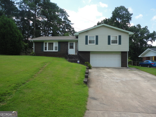 gamls lockbox on front door, applications on website, do NOT use showing time, just show it. New paint, new carpet, family room, with dining and Den, garage can not be use as garage, it is partly built in. Large property.