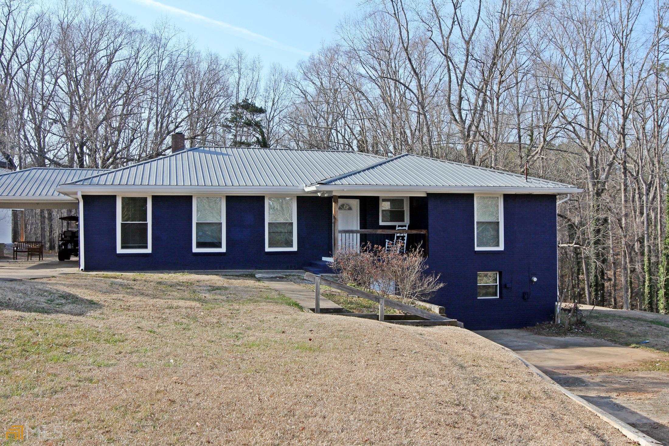 Don't miss out on this charming ranch home - NO HOA in a highly sought-after BUFORD CITY SCHOOL DISTRICT!! Extremely convenient to LAKE LANIER ISLANDS RESORT, shopping, restaurants, and plenty of entertainment. Adorable 2 bedroom 4 bathroom home on an unfinished basement. Open concept kitchen that overlooks the family room and dining area with brick fireplace. Gorgeous durable hardwood flooring throughout the home. Primary suite on the main including a bright kitchen with a separate soaking tub and shower. Spacious sun room and exterior access with patio, perfect for entertaining. Enjoy the huge lush backyard with additional space to expand and enjoy.