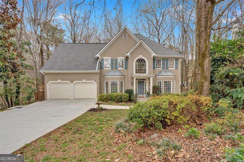 Escape to your own private oasis in this exquisite home nestled on a peaceful cul-de-sac in one of the area's most sought-after neighborhoods. Mature landscaping welcomes you as you approach the home, hinting at the beauty within. Step inside and be greeted by a grand two-story foyer bathed in natural light streaming through a transom window. To the left, a formal dining room with elegant chair railing awaits, ready to host unforgettable gatherings of up to 12 guests. On the right, discover a versatile space perfect for a formal living room, home office, or cozy library. The heart of this home is undoubtedly the chef-inspired kitchen. Boasting custom-painted cabinetry, gleaming quartz countertops, stainless steel appliances, and a stylish tile backsplash, it's a haven for culinary creativity. Imagine preparing gourmet meals while enjoying conversation with loved ones gathered around the breakfast bar. The adjacent breakfast area seamlessly flows onto an expansive deck, an ideal setting for morning coffee, al fresco dining, or simply unwinding while surrounded by the sights and sounds of nature. A convenient half bath and laundry room complete this level. Upstairs, retreat to the luxurious primary suite, a true sanctuary. A tray ceiling adds architectural interest, while the spa-like en-suite bath promises relaxation and rejuvenation. Indulge in the dual vanities, illuminated LED mirrors, a fully tiled frameless glass shower, and a breathtaking black pedestal soaking tub. The huge walk-in closet with his-and-hers sides and custom built-ins provides ample space for your wardrobe. Two generously sized secondary bedrooms share a Jack-and-Jill bath, while a third bedroom enjoys a private en-suite bath and large walk-in closet. A fifth bedroom offers a cozy cove perfect for a reading nook or study area, along with direct access to a private staircase. The finished basement presents endless possibilities. Create a guest suite, in-law apartment, home gym, or entertainment haven. A bedroom with a spacious closet, a convenient kitchenette, and a covered screened porch provide comfort and flexibility. A media room sets the stage for movie nights and family gatherings. Outside, discover your own private retreat. Half an acre of land invites outdoor enjoyment. Gather with friends and family under the pavilion, complete with a shuffleboard court and built-in bar. This exceptional property offers the perfect blend of luxury, comfort, and privacy. Don't miss the chance to make this dream home your own! Schedule your private showing today and experience the magic for yourself."