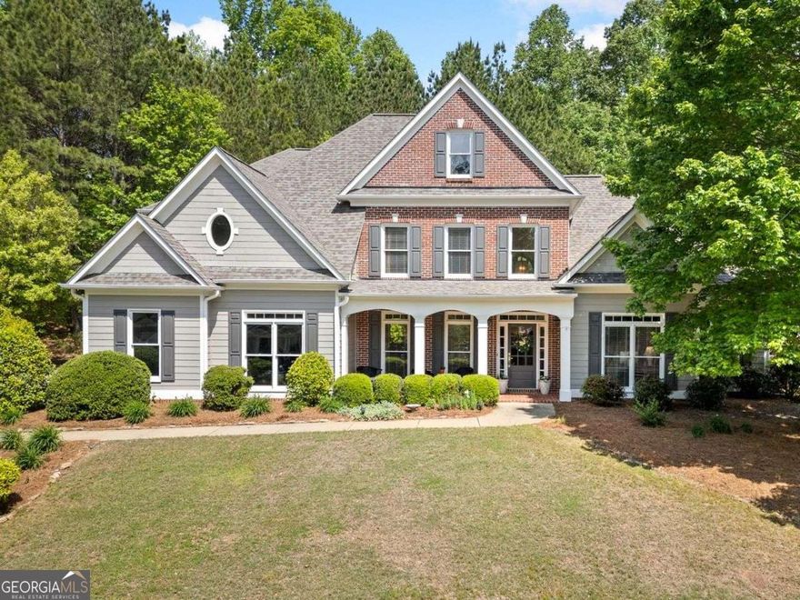 Tucked away in the beautiful neighborhood of Laurel Brooke, you'll find a home that cannot be beat. Convenient to Downtown Woodstock, Milton, Alpharetta, Roswell, Interstates and in a top-rated school district. First time offered on market; this move-in ready home has been lovingly cared for and updated by the original owners. As you walk up to this grand home, you're greeted by an expansive front porch. The open floor plan allows for a seamless flow between living areas, creating a comfortable and inviting atmosphere. The main level features real oak hardwood flooring throughout, a two-story Foyer, a Formal Dining Room with trayed ceiling, a vaulted Living Room makes the perfect Study or Home Office, the two-story Great Room with floor to ceiling windows and an abundance of natural light, enhancing the overall ambiance. Looking for a private and tranquil Primary Suite? The generously sized Primary Suite has a sitting area perfect for relaxing. The En-Suite Bathroom provides a relaxing oasis, with dual vanities, walk-in shower, garden tub, and two walk-in closets. The Kitchen is a culinary delight with real wood cabinets, stainless steel appliances, quartz countertops, quartz backsplashes and a vaulted Breakfast Room with views of the Great Room. Take the stairs up and you'll discover three generously sized Secondary Bedrooms. One Bedroom features a vaulted ceiling and a private Ensuite bathroom. Two additional Bedrooms share a jack-n-jill bathroom. Plenty of storage available with direct attic access. Whether you're enjoying a quiet morning, hosting a BBQ, watching nature unfold in your backyard, or sitting by your Koi Pond, you'll be creating lifelong memories in your new home.