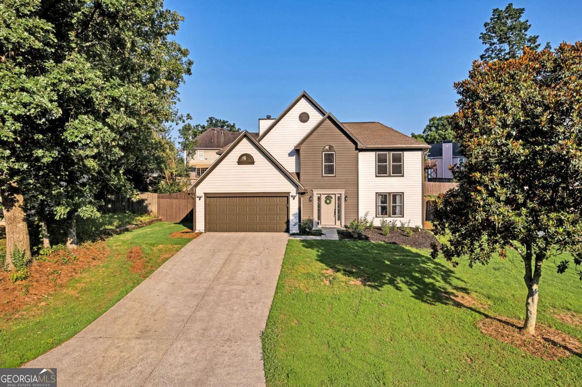ARE THE HIGH INTEREST RATES STILL HOLDING YOU BACK? NO PROBLEM, THIS MOTIVATED SELLER IS WILLING TO CONTRIBUTE UP TO $11,000 FOR A 2/1 RATE BUY DOWN TO HELP WITH THOSE HIGH MONTHLY PAYMENTS! This is the move-in-ready Kennesaw home you've been waiting for! This beautifully updated 4-bedroom, 2.5-bath home offers timeless design and thoughtful modern touches. The bright, open floor plan features a spacious living area with a gas fireplace, a cozy sunroom, and a fully remodeled kitchen with white cabinetry, quartz countertops, new stainless steel appliances, and pantry space. The oversized primary suite boasts a walk-in closet, double vanity, a spa-inspired tiled shower, and a separate soaking tub for peaceful moments. Step outside to enjoy your morning coffee or entertain on the private, fenced backyard patio, ready for gatherings and relaxation. Live just minutes from Kennesaw State University, Kennesaw Mountain, Swift-Cantrell Park, Town Center Mall, restaurants, and top-rated Cobb County schools, with convenient access to I-75 and Wade Green Rd. Additional upgrades include brand-new interior and exterior paint, new luxury flooring throughout, new light fixtures, a new water heater, double-pane windows, and a two-car garage with kitchen-level entry. Don't miss this incredible opportunity-schedule your private tour today and fall in love with your next home! *RATE BUYDOWN APPLIES TO A FULL PRICE OFFER*