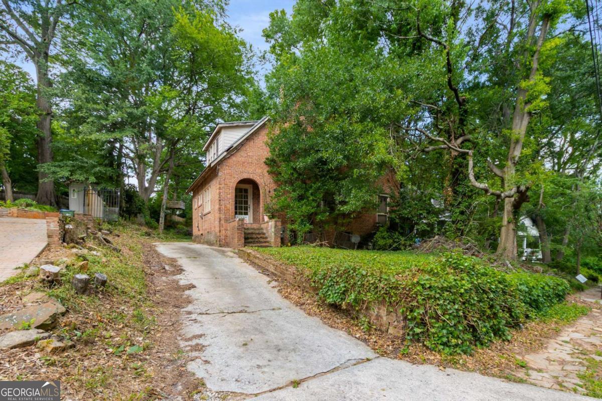 An exceptional opportunity to own a prime Candler Park lot with plans to build a 5 bedroom, 5 bathroom home featuring an attached two-car garage on a spacious 0.26-acre lot. Alternatively, reimagine the existing 3 bedroom, 3 bathroom all-brick structure as a smaller scale project. All utilities including public sewer, water, and electricity are already available on-site. Located in the heart of one of Atlanta's most sought-after neighborhoods and zoned for Mary Lin Elementary, this property offers immediate access to Candler Park, a scenic 55-acre green space known for its vibrant community events, festivals and relaxed, outdoor lifestyle. The park includes a 9-hole golf course, tennis courts, ball fields, a swimming pool, and multiple playgrounds-perfect for all ages. Enjoy seamless connectivity to Atlanta's top destinations via the nearby PATH trail, which runs alongside the park and links directly to the Atlanta BELTLINE. Residents also benefit from proximity to the charming Candler Park commercial district, Candler Park Market, and the eclectic mix of shops, music venues and restaurants in nearby Little Five Points. Plus, the popular Freedom Farmers Market at the Carter Center offers fresh, local goods every weekend. This is an ideal setting to build or customize your dream home in an established, historic neighborhood. Reach out to Listing Agent Alex Smith Meier for plans and survey.