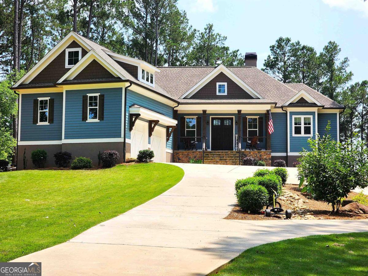 Waterfront custom home on Lake Oconee in Forest Glen, Greensboro with Max Dock. Lovely home, with great space for everyone. Built in 2020, five Bedrooms, four and a half Baths, plus bonus room upstairs. Primary Bedroom, 2 Bedrooms and 2 and a half Baths and laundry are on the main level. Terrace level has recreation room-den with kitchenette, media room, 2 bedrooms and 2 baths. Hardwood floors main level, LVP lower level, Tiled baths throughout. The Open plan has a wonderful Kitchen, Living room with stone fireplace and cathedral ceiling and overlooks a beautiful, large covered porch and fenced yard, leading to waterfront and max dock with boat and jet ski lifts. There is a 2 car garage, plus a golf cart, boat toy garage on the lower level along with a second laundry and tons of space for a workshop and storage. Newer homes surround the property. Greene County with easy access to Greensboro, Madison and Athens. Owners enjoy using Instacart delivery from Publix & Costco. Greene County Schools. A peaceful neighborhood and setting for enjoying Lake Oconee.