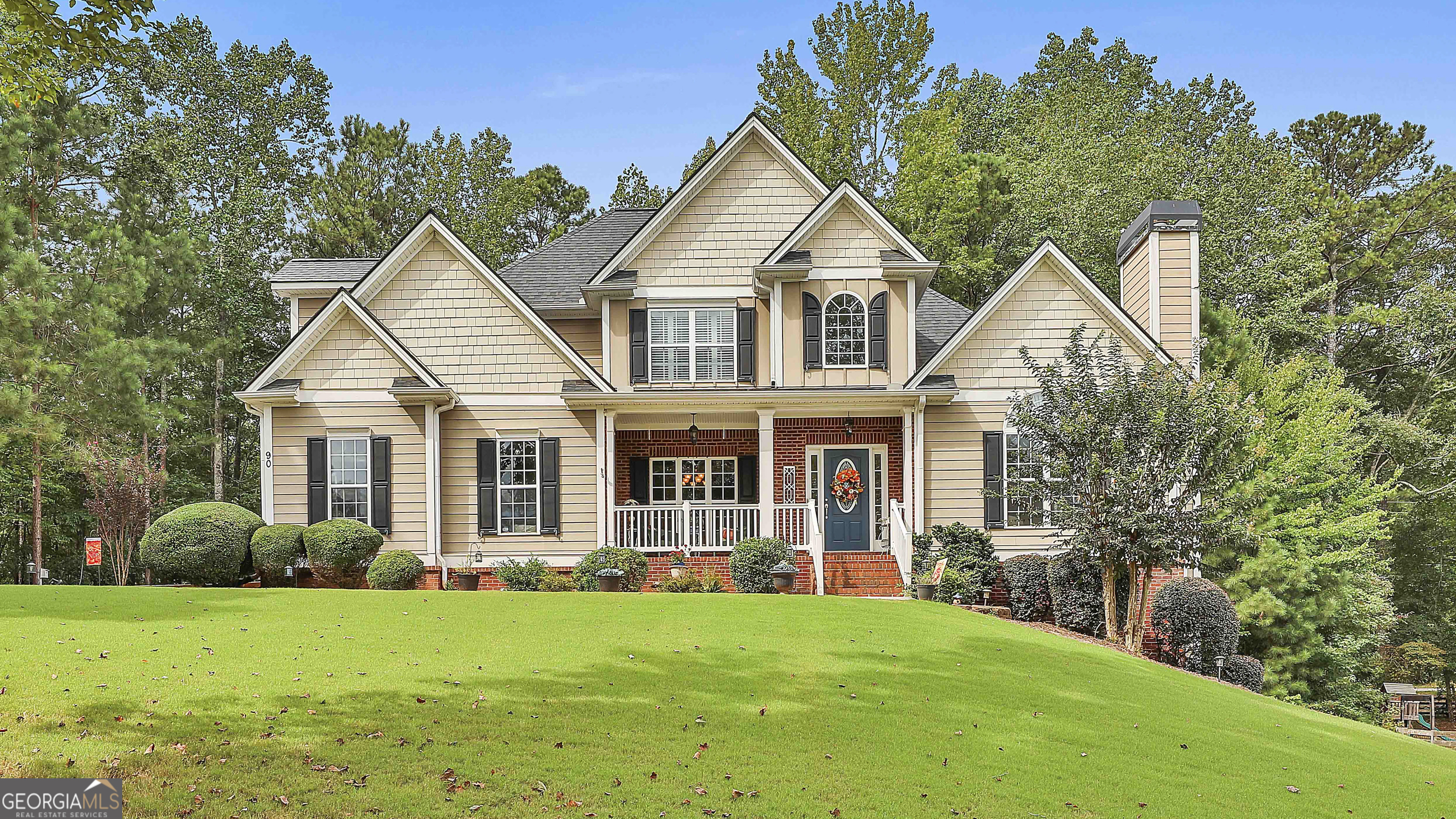 Welcome to this stunning Lake Redwine home, built by Steve Poss, offering 4 bedrooms and a fully finished basement. Step inside from the inviting rocking chair front porch into a grand two-story foyer that opens to the formal dining room with coffered ceilings and the spacious living room featuring a stacked stone fireplace. The kitchen is designed for both style and function with abundant cabinetry, a gas stove, double oven, and a bright eat-in area. The oversized primary suite on the main floor has a cozy sitting area with fireplace, while the en suite bathroom offers dual sinks, a separate shower and tub, and a walk-in closet. A half bath and laundry room complete the main level. Upstairs, find three guest bedrooms, two of which include en suite bathrooms. The fully finished basement expands the living space with a large living area, two versatile flex rooms, a full bathroom, and an unfinished workshop with double doors and exterior access. Enjoy outdoor living on the back deck, redone in Summer 2024, or take peace of mind in knowing the roof was replaced in 2021. Schedule your showing today! Southeast Mortgage is our preferred lender. If buyer chooses to work with them, Southeast Mortgage will provide 1% credit up to $5,000. Reach out to the listing agent for more information.