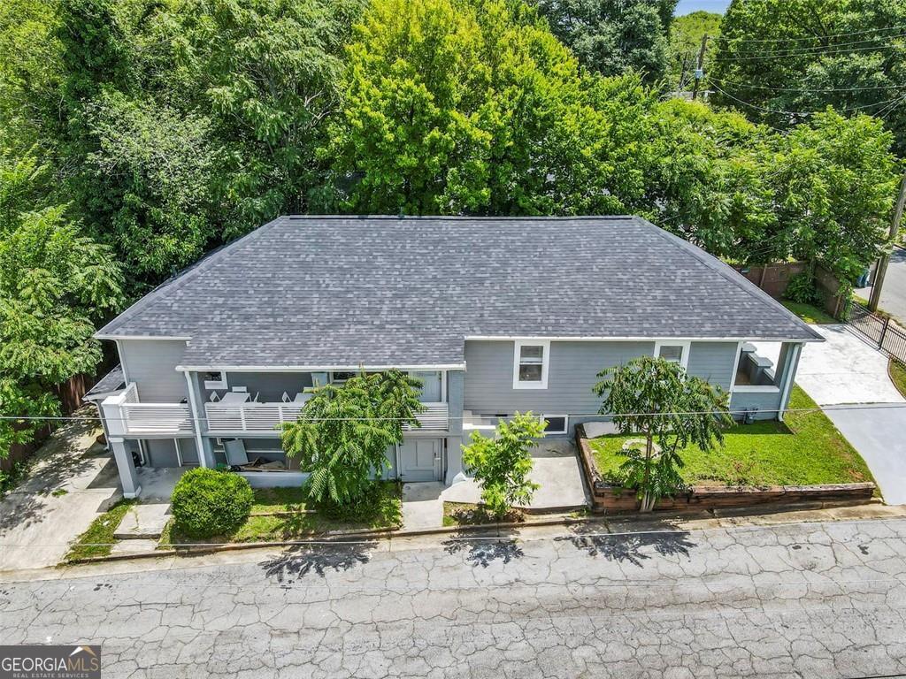 DUPLEX / PADSPLIT / STR || || NO HOA & NO RENTAL RESTRICTIONS || || SPACIOUS CORNER LOT || || LOWER LEVEL WITH COMPLETE KITCHEN || || MODERN STAINLESS APPLIANCES & KITCHEN ISLAND || || OPEN CONCEPT MAIN LEVEL PERFECT FOR ENTERTAINING || || WALKING DISTANCE TO PITTMAN PARK || || EASY ACCESS TO SHOPPING & RESTAURANTS || ** What You'll See ** Step into this stunning CORNER LOT HOME bathed in NATURAL LIGHT that highlights the modern, open-concept layout. Admire the sleek STAINLESS STEEL APPLIANCES in the kitchen, the SPACIOUS ISLAND with a view into the family room, and the versatile floor plan offering 7 bedrooms perfect for family or guests. On the lower level, you'll find a complete second home with its own kitchen, ideal for multigenerational living or rental opportunities. ** What You'll Hear ** Enjoy the quiet ambiance of a SMOKE-FREE, PET-FREE HOME in a serene neighborhood. You'll hear laughter and conversation flowing easily in the open main level, perfect for entertaining. Just a short stroll away, you'll hear the lively sounds of children playing and community activities at nearby Pittman Park. ** What You'll Feel ** Feel the warmth of a thoughtfully designed space with a layout that offers comfort, flexibility, and convenience. Whether you're hosting in the open kitchen or retreating to one of the 7 spacious bedrooms, this home has been designed to make living easy. The CORNER LOT adds privacy, while the natural light streaming in creates a bright and cheerful atmosphere. ** What You'll Experience ** Experience the freedom of NO HOA OR RENTAL RESTRICTIONS, allowing you to use the property in ways that fit your lifestyle. Live on the main level and rent the lower level, or rent both for ADDED INCOME! Enjoy proximity to shopping, restaurants, and recreation, with Pittman Park just a short walk away. Whether you're entertaining, relaxing, or exploring the local amenities, this home truly has it all. **Furniture is available for purchase!**