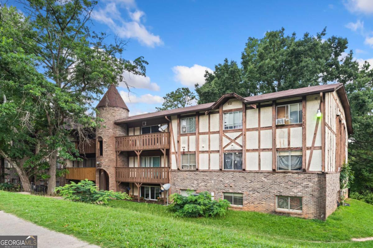 Investor Special - Third Floor Opportunity! Welcome to 1315 Camelot Drive, a spacious 3-bedroom, 2-bath condo offering over 1,200 square feet of value packed potential. Situated on the third floor, this unit is an excellent opportunity for savvy investors looking to capitalize on the rapid transformation happening in the Old National corridor. Just minutes from the highly anticipated Town Center at Mansa Park, a 140-acre mixed-use development, this area is positioned for massive growth. With close proximity to Hartsfield-Jackson Airport, public transportation, and major highways like I-285, I-85, and GA-166, this location offers unmatched convenience for future tenants. Walking distance to shops, groceries, and local amenities further enhances its rental appeal. Market rents in the area are trending around $1,300/month or more, making this an ideal buy-and-hold property with excellent income potential. Seller is highly motivated and ready to make a deal! Bring your best CASH or non-conforming conventional offer. No seller financing available. Don't miss your chance to invest in one of South Atlanta's most promising neighborhoods! You will thank yourself later!