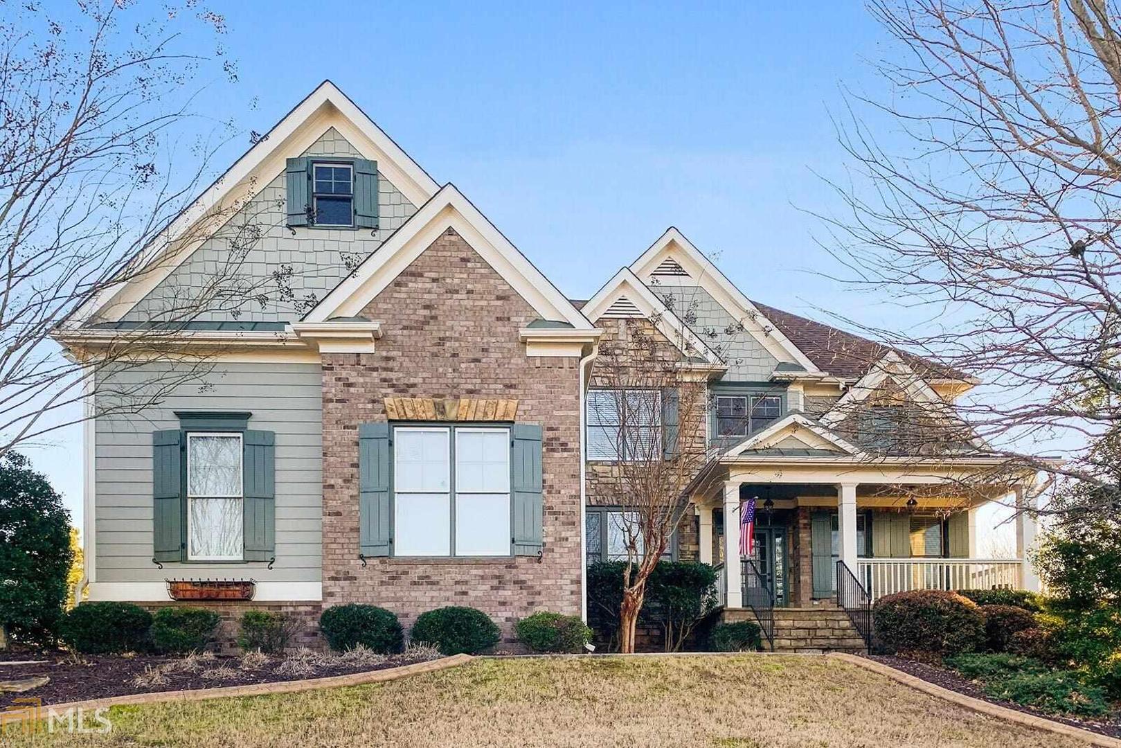 Beautiful updated home overlooking a fabulous Gunite Pool with a waterfall feature. Enter the home from the large covered front porch, into a beautiful two story Foyer with views into the Great Room and to the open staircase and upper level. To the right of the Foyer is a private Office with french doors. On the left is a gorgeous large Dining Room. Hardwood floors through the main. Then enter into the Great Room which has a 12 Ft coffered ceiling, built in bookcases, a wood burning fireplace, and views the screened porch and pool.To the right of the great Room, a hallway leads to the Guest bedroom and a full Bath. From the Great Room enter into the magnificent open updated Kitchen with new stainless appliances, a new oversized island, 10' x 5.5', which includes storage and a new farmhouse sink, all topped with Leathered Marble. Kitchen is open to the Keeping Room with a beamed wood ceiling, a Fireplace, all viewing the deck and pool area. Fabulous screened porch and a deck view the large fenced backyard and the Gunite Pool with a waterfall feature. Upstairs a luxury Master Suite with sitting room and trey ceiling, a large Master Bath with black granite, dual sinks, whirlpool tub, a large dual head shower, and a master closet that is huge, 25' x 15'. Upper hallway leads to a Bedroom with a private bath, plus three additional Bedrooms and a Jack and Jill Bath. All completed by a full basement ready to finish to your liking All in convenient West Cobb near schools, shopping, and dining. In the Harrison High district. New roof, new paint inside and out, and new hot water heater. House is well maintained and in pristine condition.
