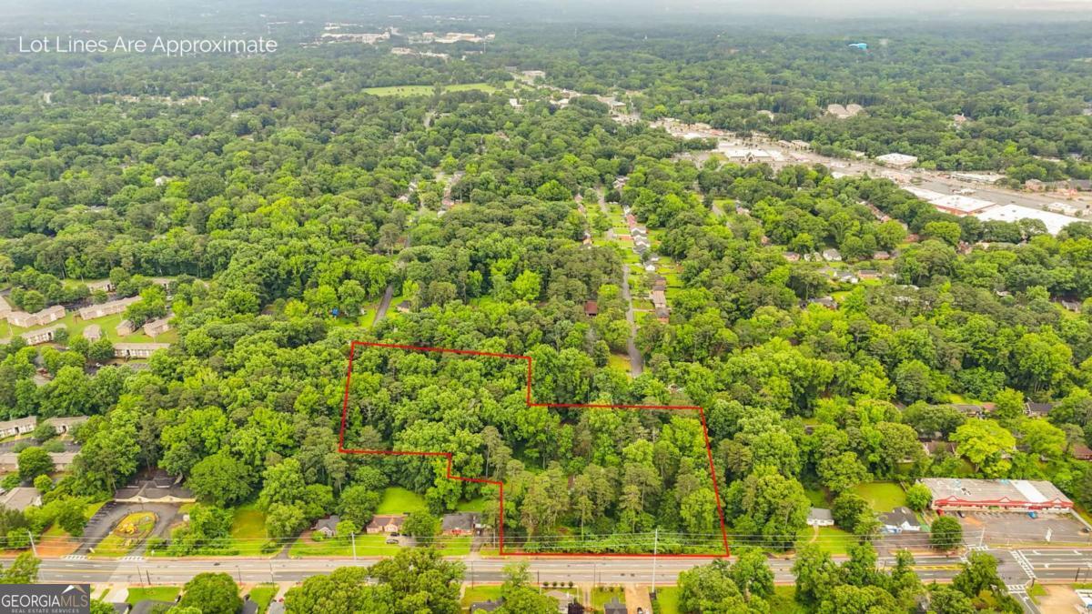 Rare 9.5-Acre Haven with Spring-Fed Pond, Multiple Structures & Endless Possibilities in Dekalb County. Tucked just off Glenwood Road, this nearly 10-acre parcel offers a one-of-a-kind blend of natural beauty, rich history, and untapped potential. Once a working farm, the land is now a thriving wilderness-complete with a spring-fed pond, mature hardwoods (oak, pine, poplar), and fertile bottomland soil that's been gardened, composted, and loved. The property features three separate driveways and multiple existing structures, including A structurally sound former farmhouse with a crystal-clear spring-fed well. A structurally sound caretaker's cottage (could be a great clubhouse overlooking the pond). A mid-century ranch currently generating rental income at $1,200/month. A secluded cabin-style home in the woods-ideal for a nature retreat or artist's residence. A fully insulated outbuilding previously used as a tiny home. This is a rare opportunity for a creative developer who sees value in integrating with the natural topography, water sources, and wooded terrain-or for a conservation-minded organization seeking a site for a nature sanctuary, community farm, or eco-minded retreat space. Interested buyer should show proof of funds, and schedule an appointment to walk the land. More aerial video and information coming. No Survey available. Old-growth trees, incredible soil, and a deep sense of serenity make this land a true hidden gem in Dekalb County. Whether you're envisioning restoration, development, or conservation, this land is ready to inspire. Contact us to walk the property and explore its full potential.