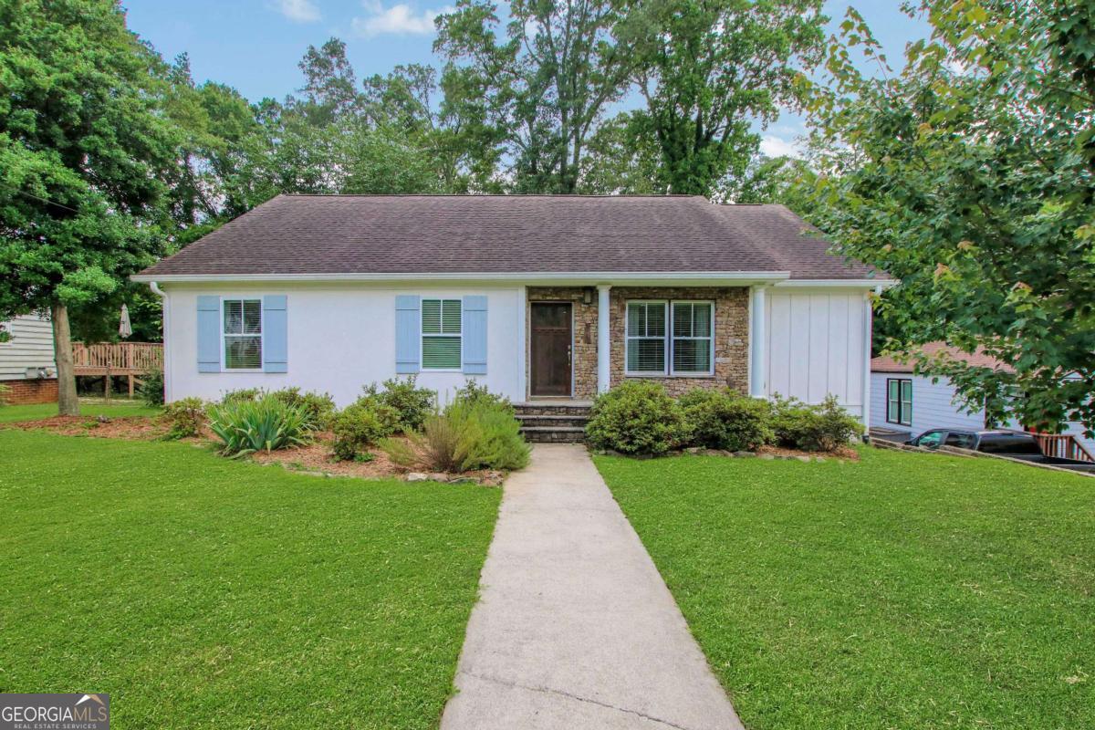 Welcome to 792 Mimosa Drive - a beautifully updated ranch just minutes from vibrant Marietta Square, with shopping, dining, and local charm right at your doorstep. From the freshly painted exterior to the warm hardwood floors throughout the main living areas, this home offers a perfect blend of comfort, style, and convenience. The open-concept kitchen and dining space features upgraded light fixtures and a bright, airy layout that's perfect for everyday living or entertaining. Step outside to a large screened-in deck, ideal for relaxing year-round, overlooking a spacious fenced backyard perfect for gatherings, gardening, or play. French doors from the primary bedroom open directly to the deck, creating a peaceful indoor-outdoor retreat. Additional highlights include modern bathroom hardware, abundant natural light, and an electric water heater. Move-in ready and full of charm, this Marietta gem offers everything you're looking for-style, space, and an unbeatable location. It's sweet, it's stylish, and it's ready to be yours. Come fall in love!