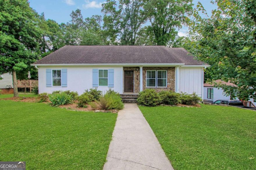 Welcome to 792 Mimosa Drive - a beautifully updated ranch just minutes from vibrant Marietta Square, with shopping, dining, and local charm right at your doorstep. From the freshly painted exterior to the warm hardwood floors throughout the main living areas, this home offers a perfect blend of comfort, style, and convenience. The open-concept kitchen and dining space features upgraded light fixtures and a bright, airy layout that's perfect for everyday living or entertaining. Step outside to a large screened-in deck, ideal for relaxing year-round, overlooking a spacious fenced backyard perfect for gatherings, gardening, or play. French doors from the primary bedroom open directly to the deck, creating a peaceful indoor-outdoor retreat. Additional highlights include modern bathroom hardware, abundant natural light, and an electric water heater. Move-in ready and full of charm, this Marietta gem offers everything you're looking for-style, space, and an unbeatable location. It's sweet, it's stylish, and it's ready to be yours. Come fall in love!