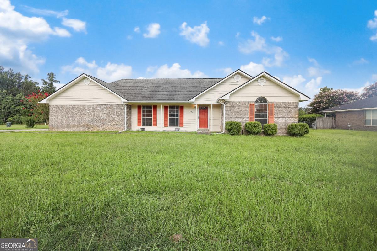 Welcome to 1100 Spruce St - this lovely three-bedroom, two-bath ranch-style home, built in 1995, is situated on a generous half-acre lot in the heart of Hinesville. Inside, you'll enjoy nearly 2,000?sq?ft of open living space, vaulted tray ceilings in the master, and a bonus sunroom bathed in natural light. Laminate and ceramic finishes flow throughout, complementing the welcoming great room with a wood-burning fireplace. Step outside to a huge fenced backyard-perfect for children, pets, gardening, or entertaining-and take in gorgeous views of the pond beyond. A covered patio invites you to unwind in serenity. With an attached two-car garage, modern appliances, and energy-efficient windows, this home combines comfort and charm in a desirable neighborhood