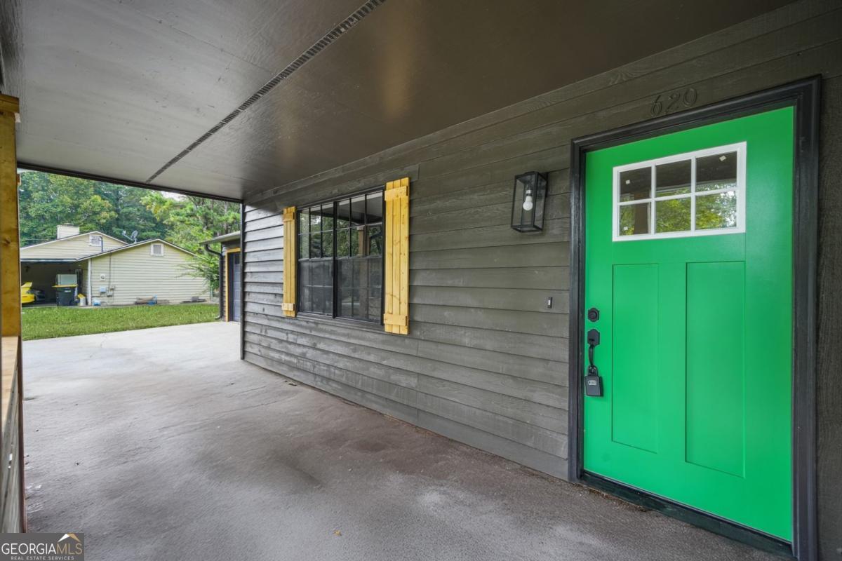 Welcome to 620 Blue Flag Lane in Fairburn! This beautifully renovated 3-bedroom, 2-bath home offers 1,404 sq ft of stylish, modern living. Inside, you'll find an inviting open layout anchored by a cozy fireplace with custom built-in bookshelves, creating the perfect spot for relaxing or entertaining. The fully updated kitchen features sleek finishes and ample storage, while both bathrooms have been thoughtfully refreshed with modern touches. The home's single-level design makes everyday living easy, with spacious bedrooms, natural light throughout, and move-in ready updates from top to bottom. Outside, enjoy a private backyard ready for gatherings, gardening, or quiet evenings. Conveniently located near shopping, dining, schools, and quick access to major highways, this Fairburn gem combines comfort, style, and location in one. Schedule your showing today-this one won't last!