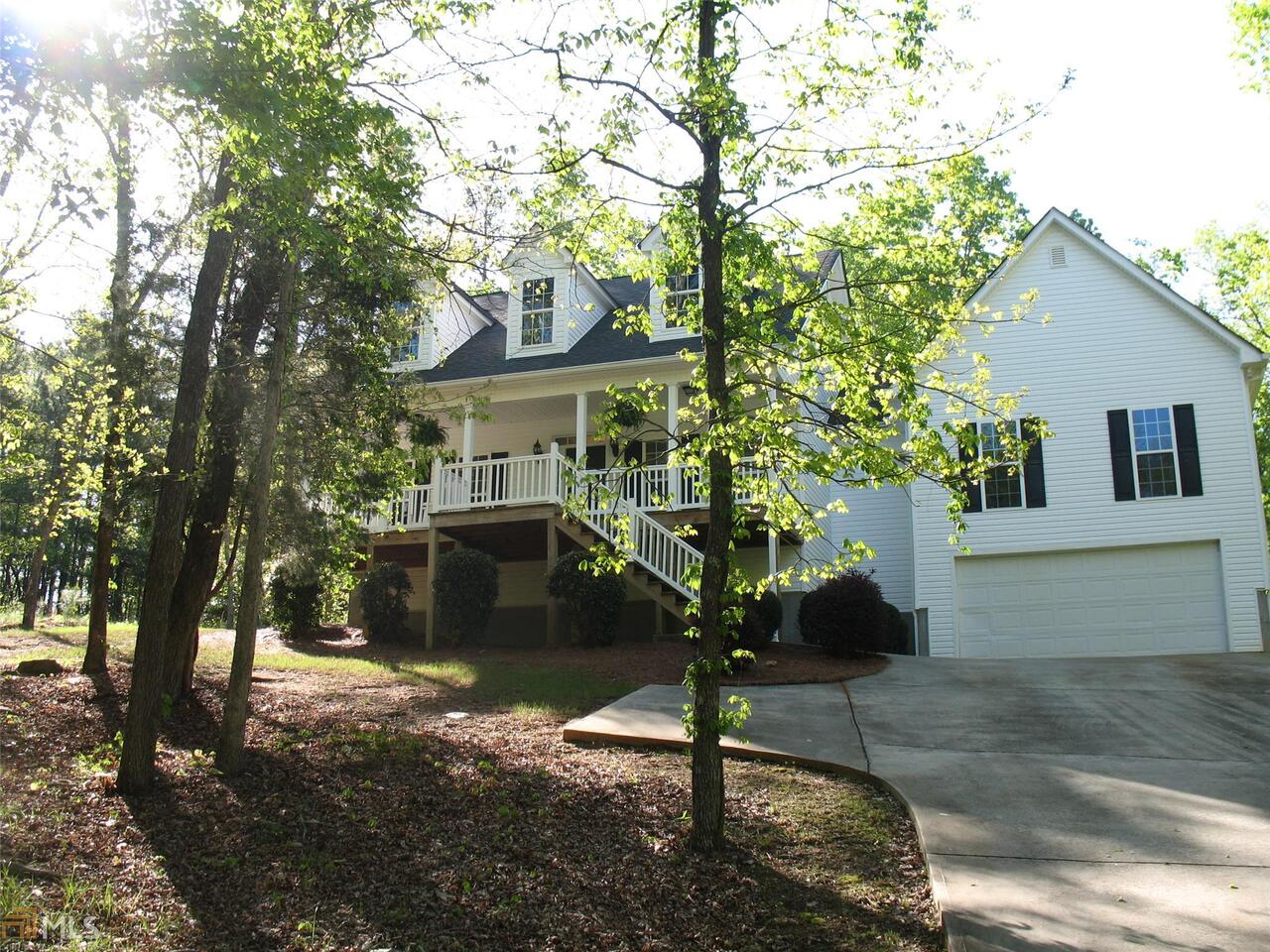 Cape Cod with relaxing front porch. Entrance foyer to separate dining room on the right and great room with stacked stone fireplace. Open concept kitchen with wall of windows. Two bedrooms and bath on one side of this split bedroom plan. Featuring master with walk in closet and En suite bath with large soaking tub, separate shower, dual sinks and water closet. Versatile room that can be bonus room with wet bar or forth bedroom. Open and Bright!