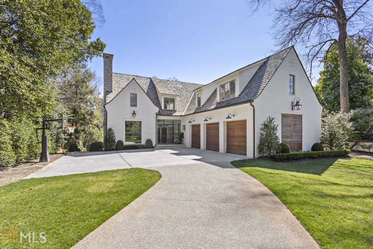 Incredible custom home located on one of Buckhead's most sought-after streets/neighborhoods where No detail has been overlooked. Herringbone patterned oak floors, reclaimed wood beams, oversized iron windows and custom lighting are among the numerous unique touches contributing to the comfortably elegant ambiance. The open main level has an airy and inviting flow centered around the spectacular kitchen boasting an oversized island clad in Vermont white marble, ceiling-height bespoke cabinetry, premium Wolf and Sub-Zero appliances, floor-to-ceiling subway tile, plus a separate butler's pantry and wet bar. Spacious primary suite is anchored by a dramatic wall of iron windows, vaulted ceiling, and sumptuous bath with dual floating vanities, upgraded walk-in shower and separate soaking tub. The expertly finished terrace level offers additional living space with a media room,game room, massive bar with temperature-controlled wine storage, exercise room and private guest suite. Outdoor entertaining takes top priority with a fireside covered patio overlooking the stunning saltwater pool, stone sun deck and turfed backyard.