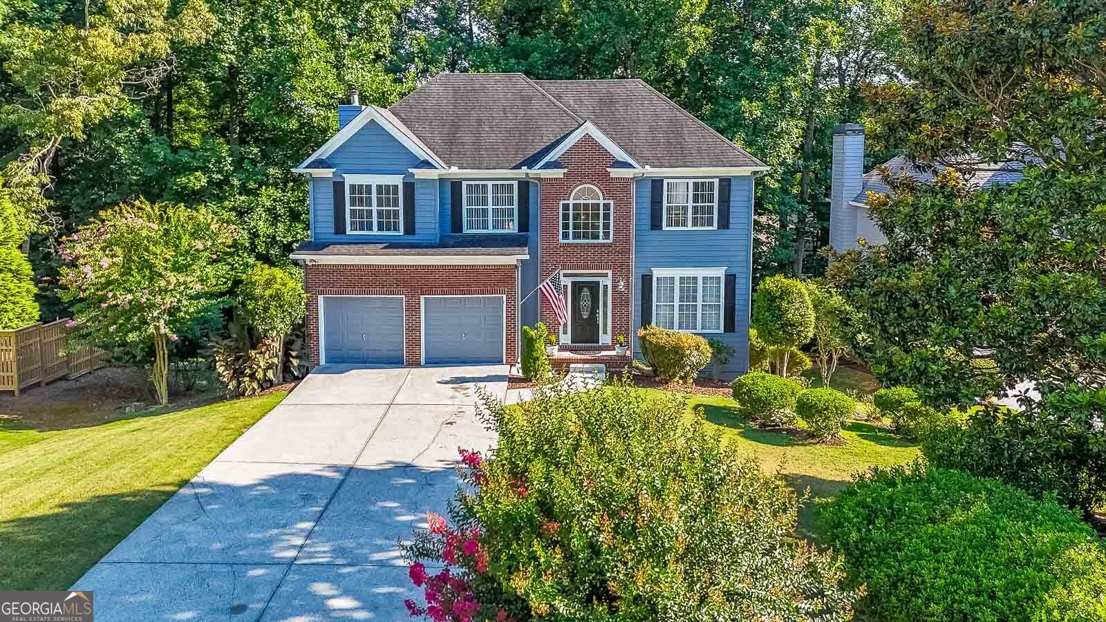 Discover this charming residence nestled in the sought-after Bridgemill community, offering a blend of comfort and luxury. From the moment you enter, you're greeted by a warm and inviting living room-perfect for relaxing or entertaining guests. The formal dining room provides a classic setting for family meals and special occasions. The heart of the home is the open-concept kitchen, featuring stainless steel appliances, granite countertops, and a cozy coffee nook. It flows seamlessly into the spacious family room, where a fireplace and large windows create a bright, welcoming space filled with natural light. Step outside onto the oversized Balcony-ideal for morning coffee, weekend BBQs, or entertaining friends in a peaceful outdoor setting. Upstairs, you'll find a luxurious owner's suite with a vaulted tray ceiling and a spa-like bathroom complete with a soaking tub, tiled shower, dual vanities, and an expansive walk-in closet. The daylight basement is partially finished, offering endless potential for a home gym, game room, or extra living space. Additional highlights include an extended driveway for extra parking and plenty of storage throughout. Enjoy access to world-class amenities including a golf course, tennis and pickleball courts, fitness center, clubhouse, and a resort-style pool with two waterslides and a Tiki bar. Ideal Location Conveniently located near I-575, Northside Cherokee Hospital, and just minutes from downtown Canton and Woodstock, with top-rated schools, shopping, dining, and entertainment right at your doorstep.