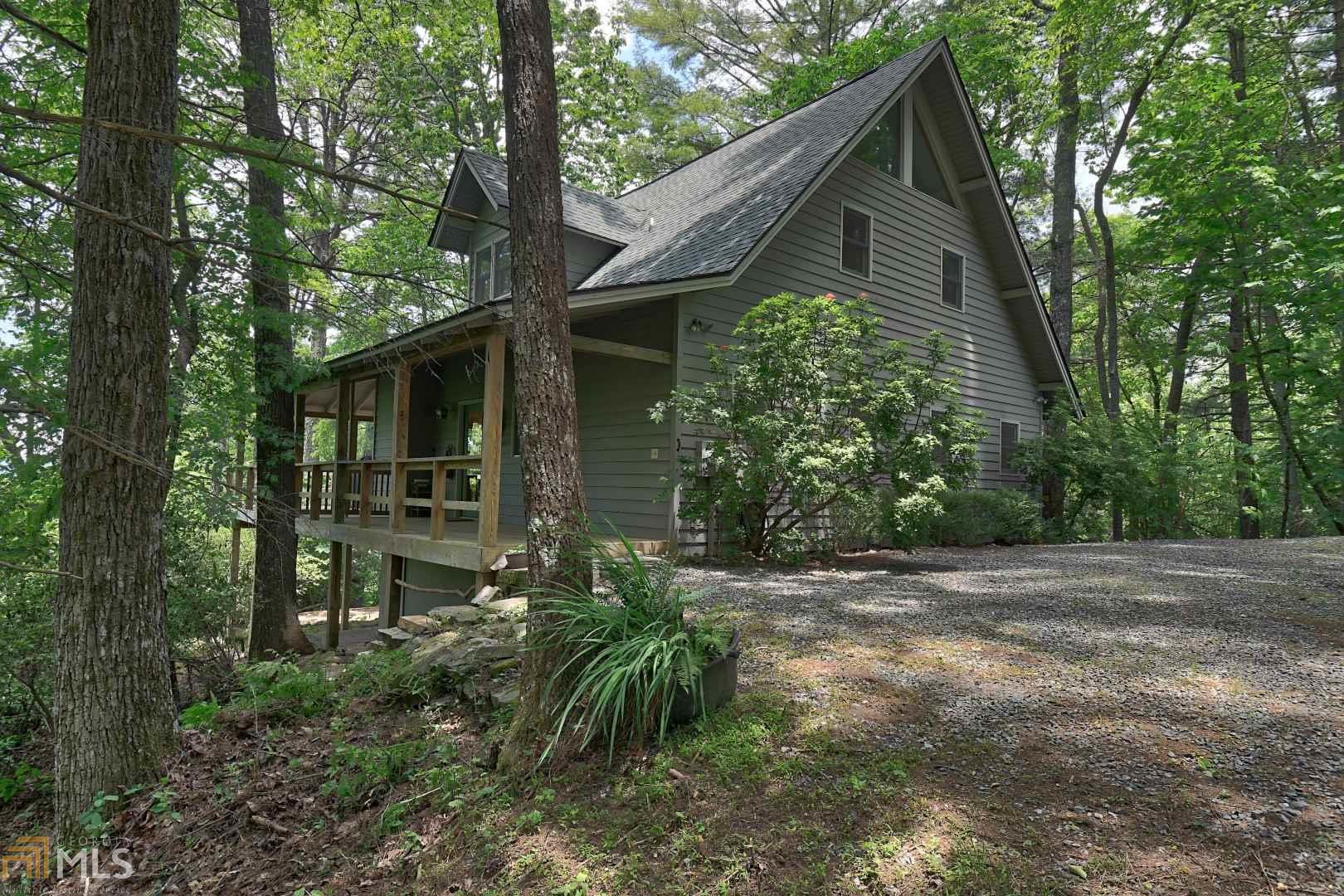 FABULOUS mountain cabin with unbelievable long range mountain views on 2+/- acres! The great-room wall of windows allows not only natural light but the enjoyment of the mountain views and lush native foliage! Hardwood floors, stone-faced fireplace with gas logs, updated kitchen with stainless steel appliances and solid surface counters along with dining area are great for entertaining. Two comfy bedrooms with shared shower complete the main floor. The master loft bedroom with sitting area, master bath and storage also take in the breathtaking views. Lower level family/recreation room with office area and tons of storage. This one is a good one! Lot 10, Parcel 1 is what is for sale.