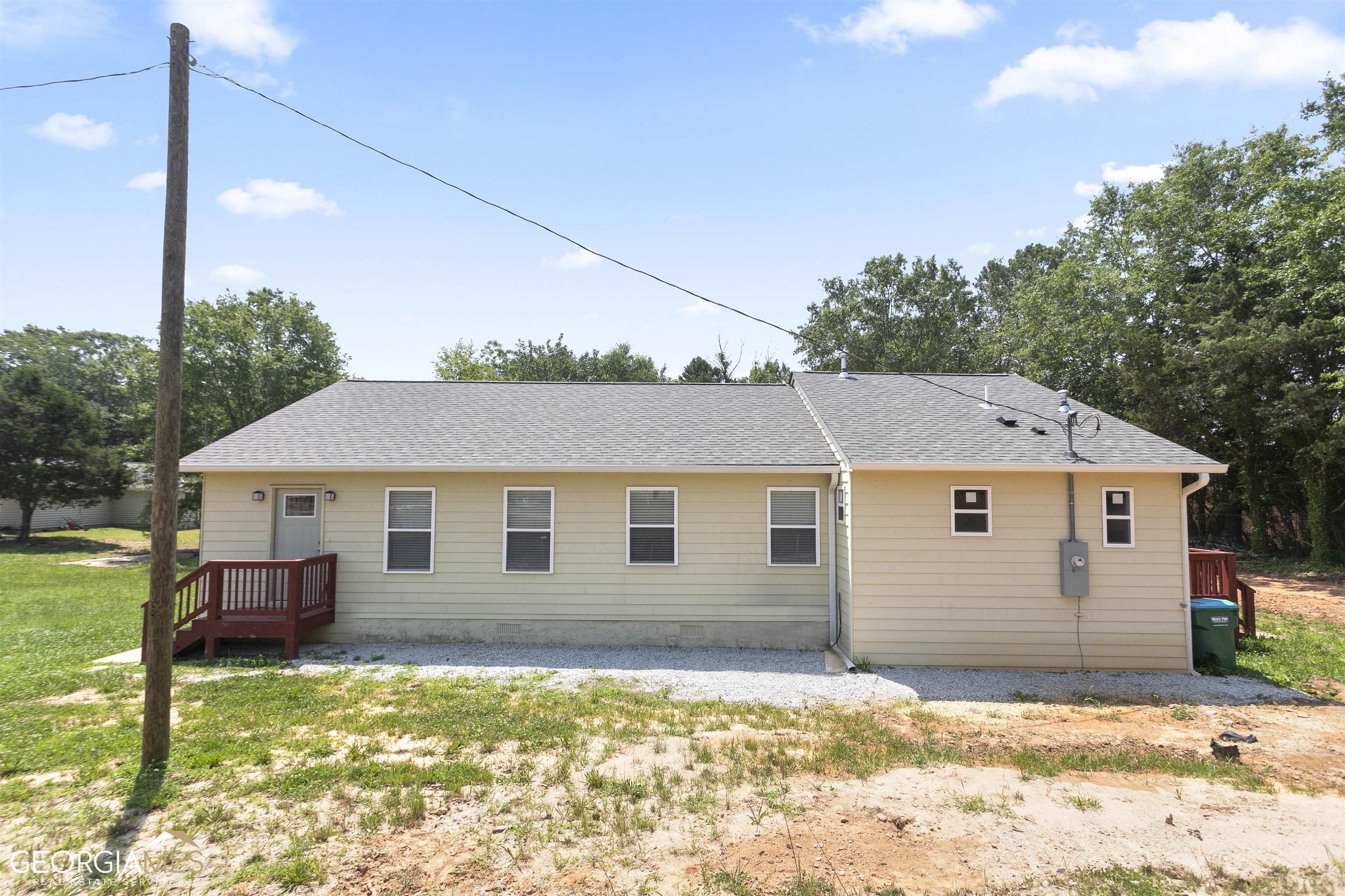 Very rare in Parkview school system. 4 bed rooms and 4 baths all attached. Major renovation done in 2022 per county code and permit. Expanded to approximately 1940 sq. ft. Mostly everything brand new. New plumbing, new wiring and electrical, new AC unit, new water heater. New roof. 0.82 Acres with newly connected to sewer system. Very elegant Granite kitchen counter top with new cabinet. New flooring. Ideal for Residential Assisted Living Facility. No HOA. Lots of frontage space to add for the future expansion. Easy and close to Hwy 78 to Emory, CDC, down town ATL.
