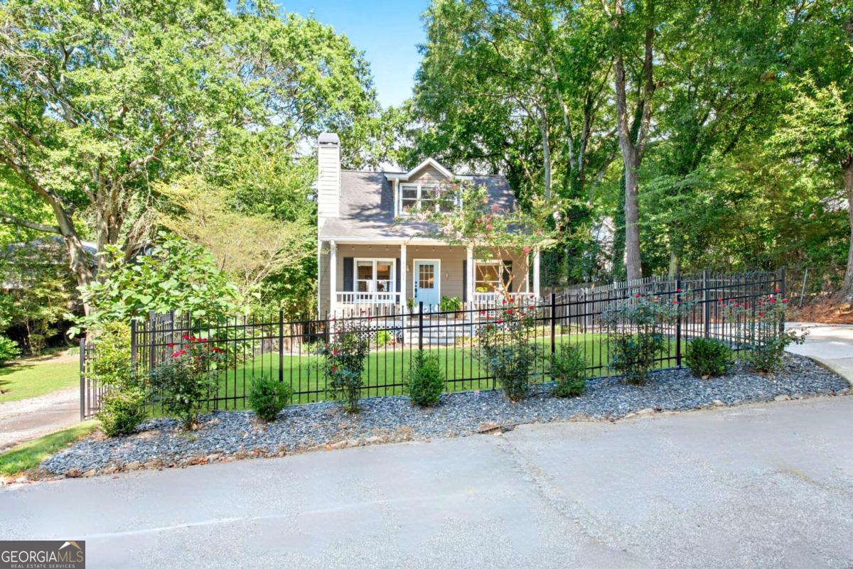Discover This Stunning 3-Bedroom, 2-Bath Home in the Heart of Underwood Hills, Where Classic Charm Meets High-End Modern Updates. Built in 1998 and Completely Redesigned by a Well-Known Designer, It Is Filled With Natural Light, Abundant Windows, and Warm Character Throughout. The Main Level Features Two Bedrooms and a Full Bath, While the Spacious Owner's Suite Occupies the Upper Level, Complete With a Luxurious Spa-Like Bathroom and a Dedicated Mini-Split System for Year-Round Comfort. Every Detail Has Been Carefully Considered-New Flooring Flows Throughout, Crown Molding Accents the Main Floor, the Entire Interior Has Been Freshly Painted, and High-End Blinds, Barn Door Leading to the Owner's Suite, New Led Lighting, and Upgraded Door Hardware Have Been Installed. Upon Entering, You're Welcomed by a Cozy Fireplace Beside the Dining Area, Leading Into a Show-Stopping Chef's Kitchen Designed for Both Beauty and Functionality. It Boasts Extensive New Cabinetry for Abundant Storage, Sleek Quartz Countertops, a Large Center Island for Prep and Gathering, and Stainless-Steel Appliances. The Open Layout Flows Seamlessly Into the Spacious Family Room, Where Oversized Windows, All-New LED Lighting, and a Layout Designed for Both Relaxation and Entertaining Create a Perfect Gathering Space. Step Outside to a True Entertainer's Dream-A Brand-New, Oversized Deck That Easily Accommodates Both Dining and Lounge Areas, Perfect for Hosting Friends, Grilling Out, or Watching an Afternoon Football Game. From Here, You Can Enjoy Views of the Professionally Landscaped Front and Backyard, Complete With Fresh Sod, a New Drainage System, and a Powered Shed Ideal for a Workshop or Extra Storage. A Freshly Painted Front Porch With a Swing Welcomes Quiet Mornings, While New Fencing in Both the Front and Back Offers Privacy for Every Outdoor Moment. Long Driveway Can Easily Fit 4 cars. The Location Is Unbeatable-Nestled in One of Atlanta's Most Vibrant, Walkable Neighborhoods, Just Steps From Underwood Hills Park, Tennis Courts, and a Dog Park, and Minutes From The Works, Topgolf, Star Provisions, Howell's, Felini's, The Daily, and More. Warm, Welcoming, and Truly Move-In Ready, This Home Offers the Very Best of Westside Living.