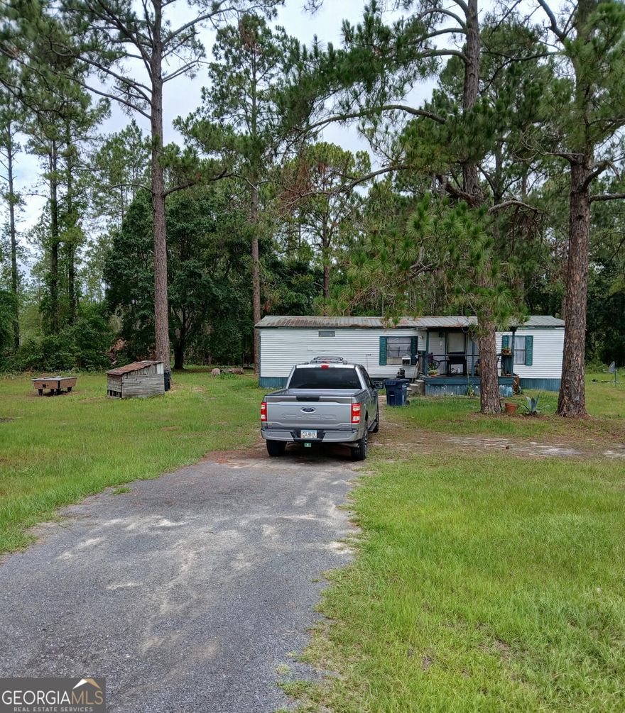 Discover this charming mobile home nestled in a serene location at 709 Spring Lake Dr, Folkston, GA. This property offers a spacious layout with comfortable living areas, appropriate for relaxation and entertaining. Enjoy the natural light that fills the home, highlighting its welcoming atmosphere. The property features a well-maintained exterior and a sizable yard, providing ample space for outdoor activities. Experience the tranquility and convenience of this delightful Folkston residence. Sold As-Is.