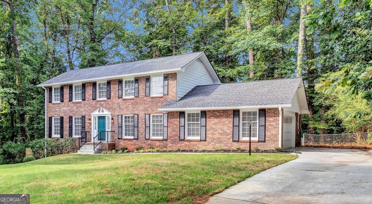Move-in ready and fully renovated in Dunwoody's coveted Kingsley neighborhood! This four-sided brick two-story home has been beautifully updated from top to bottom. Hardwood floors flow throughout the main living areas, complemented by luxury vinyl plank in the finished basement and tile in all bathrooms. The brand-new kitchen features custom cabinets, quartz countertops, and stainless steel appliances. Upstairs, both bathrooms showcase double vanities and modern finishes. Recent upgrades include fresh paint, new insulation, new toilets, and a roof that is only one year old (per inspection). The finished basement provides flexible space for a home office, media room, or guest suite. Outside, enjoy the walkable, tree-lined Kingsley community with optional swim and tennis. Ideally located near top-rated schools, grocery stores, and shopping, this rare Dunwoody home is truly beautiful inside and out. Don't miss your chance to see it!