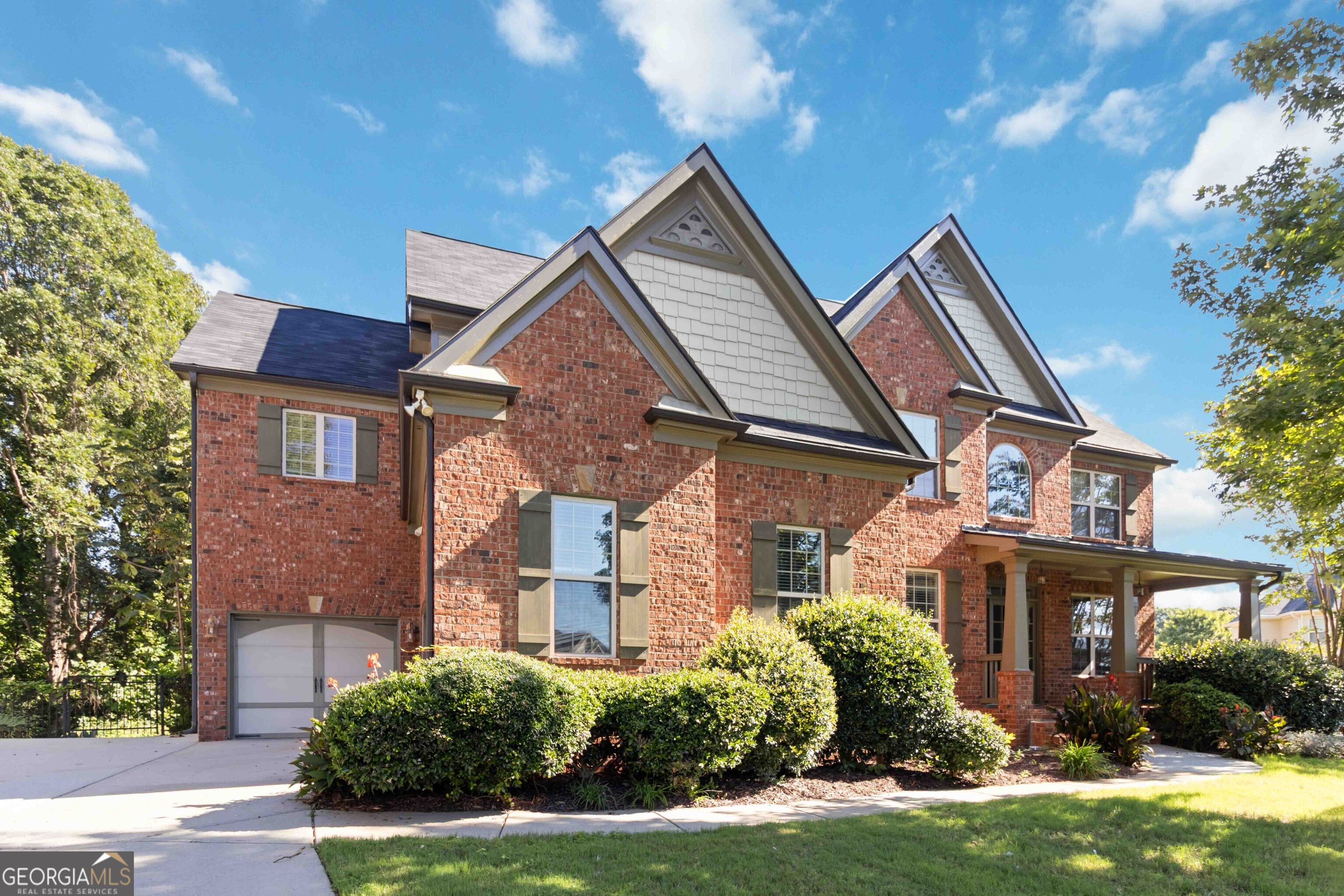 Stunning Brick-Front Home in Gwinnett County - Backing to Mulberry Park! Welcome to this elegant two-story home nestled on a quiet cul-de-sac in sought-after Gwinnett County. 2-story brick front - this home offers an abundance of space, style, and high-end finishes throughout. Step into a grand 2-story foyer that sets the tone for the rest of the home. The inviting family room boasts a coffered ceiling, custom built-in bookcases, and one of three fireplaces, creating a cozy and sophisticated space to relax or entertain. The heart of the home is the expansive kitchen with a huge center island, ideal for gatherings and culinary creations. Enjoy meals in the separate dining room enhanced by an elegant tray ceiling, or unwind in the bright keeping room with its own fireplace perfect for morning coffee or reading. The luxurious primary suite is a true retreat with a fireplace, spa-like bath, and upscale finishes. Three spacious secondary bedrooms offer bathroom access, ensuring comfort and convenience for family or guests. Additional highlights include tile floors in all bathrooms and thoughtfully designed living spaces that blend comfort with sophistication. Don't miss this rare opportunity to own a home that combines classic charm with modern elegance, all on a private lot that backs to serene parkland.