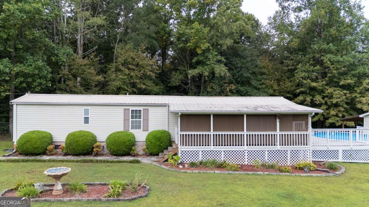 Looking for a property that provides value, beautiful country views, great landscaping, and very absolutely well taken care of?!?!? 253 Mountain Oak Drive in Murray County is the property. This well maintained property has several outbuildings, plenty of parking, an above ground pool, and a beautiful front porch with shutters installed and a GREAT setting for your morning coffee. Schedule your viewing today to view this great property before it goes quick! Send your offers because these seller are ready to SELL, SELL, SELL. Property is sold "AS-IS"