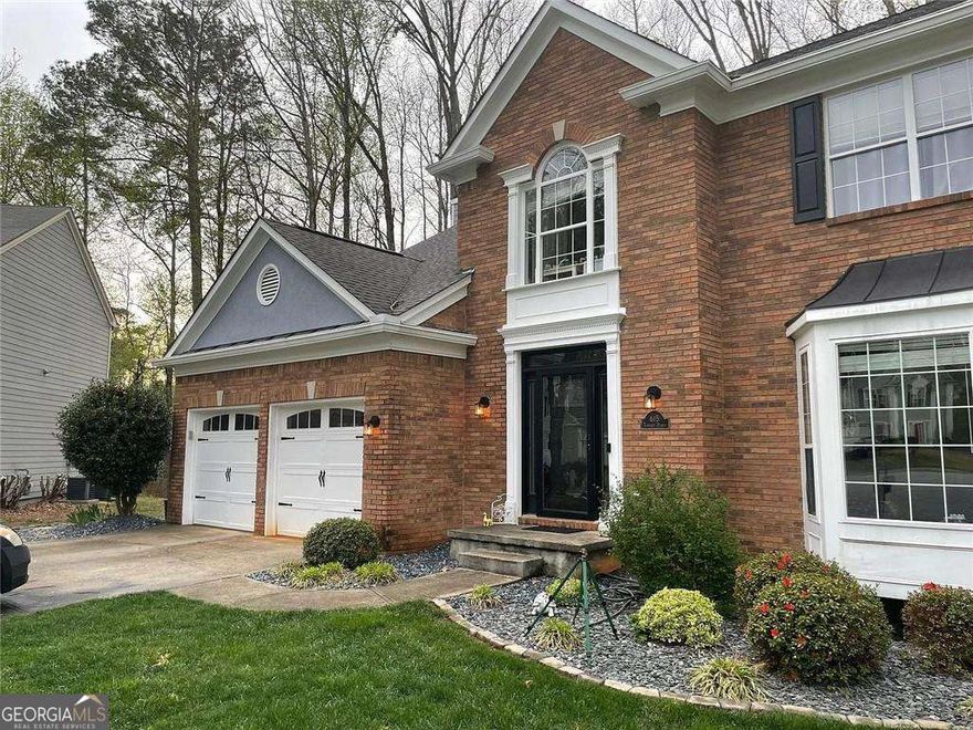 Nestled in a peaceful cul-de-sac, this beautifully maintained 4-bedroom, 2.5-bathroom home offers a perfect blend of comfort, convenience, and style. The chef's kitchen is the heart of the home, featuring Mocha Glazed Maple cabinets, granite countertops, a tile backsplash, stainless steel appliances, and a seamless connection to the spacious family room-ideal for everyday living and entertaining. Formal living and dining rooms provide additional space for hosting guests or relaxing with loved ones. Throughout the home, you'll find warm OAK HARDWOOD FLOORS, enhancing the open layout and inviting atmosphere. Upstairs, all four bedrooms are generously sized, with the primary suite offering an updated en-suite bath complete with new shower doors and fixtures. A convenient upstairs laundry room adds to the home's practical design. Step outside to a LARGE, PRIVATE BACKYARD with a deck-perfect for weekend barbecues, outdoor gatherings, or peaceful moments surrounded by nature. The FULL BASEMENT features a finished recreation room that can be used as a home office, gym, playroom, or workshop, along with ample storage space. Located in a highly desirable community known for its EXCELLENT SCHOOLS-including a new high school-and just a short WALK to shopping plazas with Kroger, Target, Walmart, Costco, restaurants, and Cogburn Park. Only 7 minutes to GA-400, Downtown Alpharetta, and Avalon! Don't miss this opportunity to own a well-cared-for home in a prime Alpharetta location. Schedule your showing today!