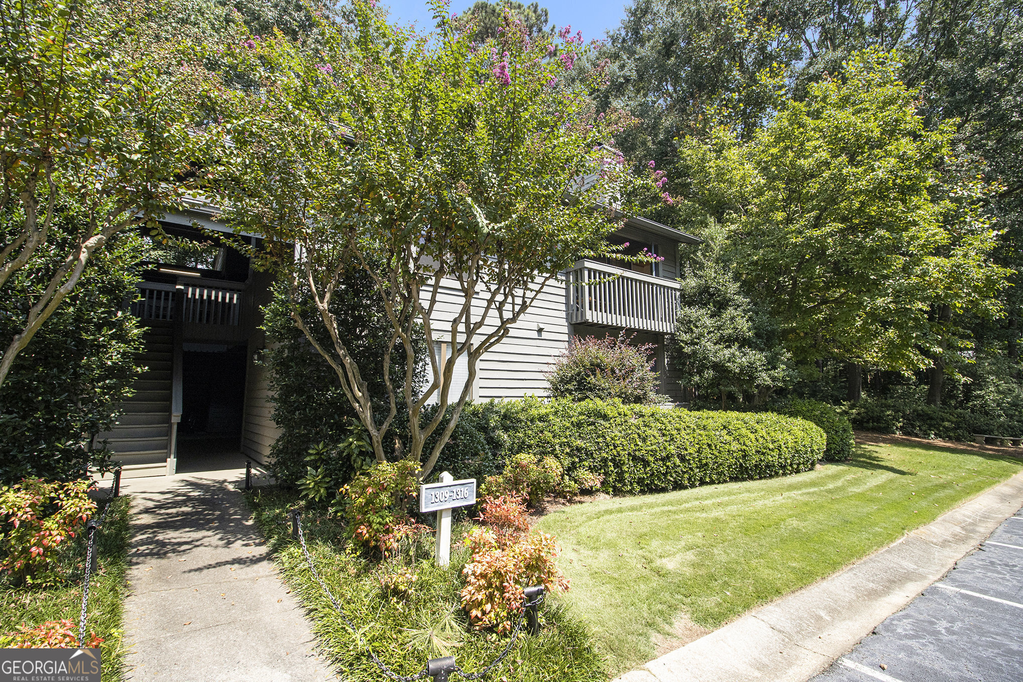 This move-in ready gem in sought-after Tuxworth Springs offers the best of everything: a top-unit FLOOR PLAN with vaulted ceilings; the prettiest LOCATION, tucked away in the wooded back of this unique, gated complex; the best CONDITON, with updated kitchen, baths and lighting; upgraded double-pane windows & patio doors; plus new paint and flooring throughout. The perfect roommate plan, this spacious 2/2 features a full bedroom, bathroom and walk-in closet on each side of the living and dining area. The renovated kitchen was designed by and for the homeowner, which means high-quality cabinets with extra drawers, storage over the sink, and pull-out shelving. The laundry / utility room also boasts tons of space for pantry and storage. Just off the living room, enjoy your own deck for dining al fresco, and another large storage closet. Tuxworth Springs is a beautifully-designed and well-managed community - it's even FHA Approved. This sprawling, gated neighborhood near the heart of Decatur offers security, comfort, ample parking in front of your building and great amenities (pool, tennis and dog walk); all in a rare, natural wooded setting, just minutes from Emory, CDC and the City of Decatur. Tuxworth residents have easy access to a plethora of restaurants and retail just across the street and up and down Scott Blvd., as well as public transport, The PATH bike & hike trails, and ATL's favorite destinations. You will LOVE living here.