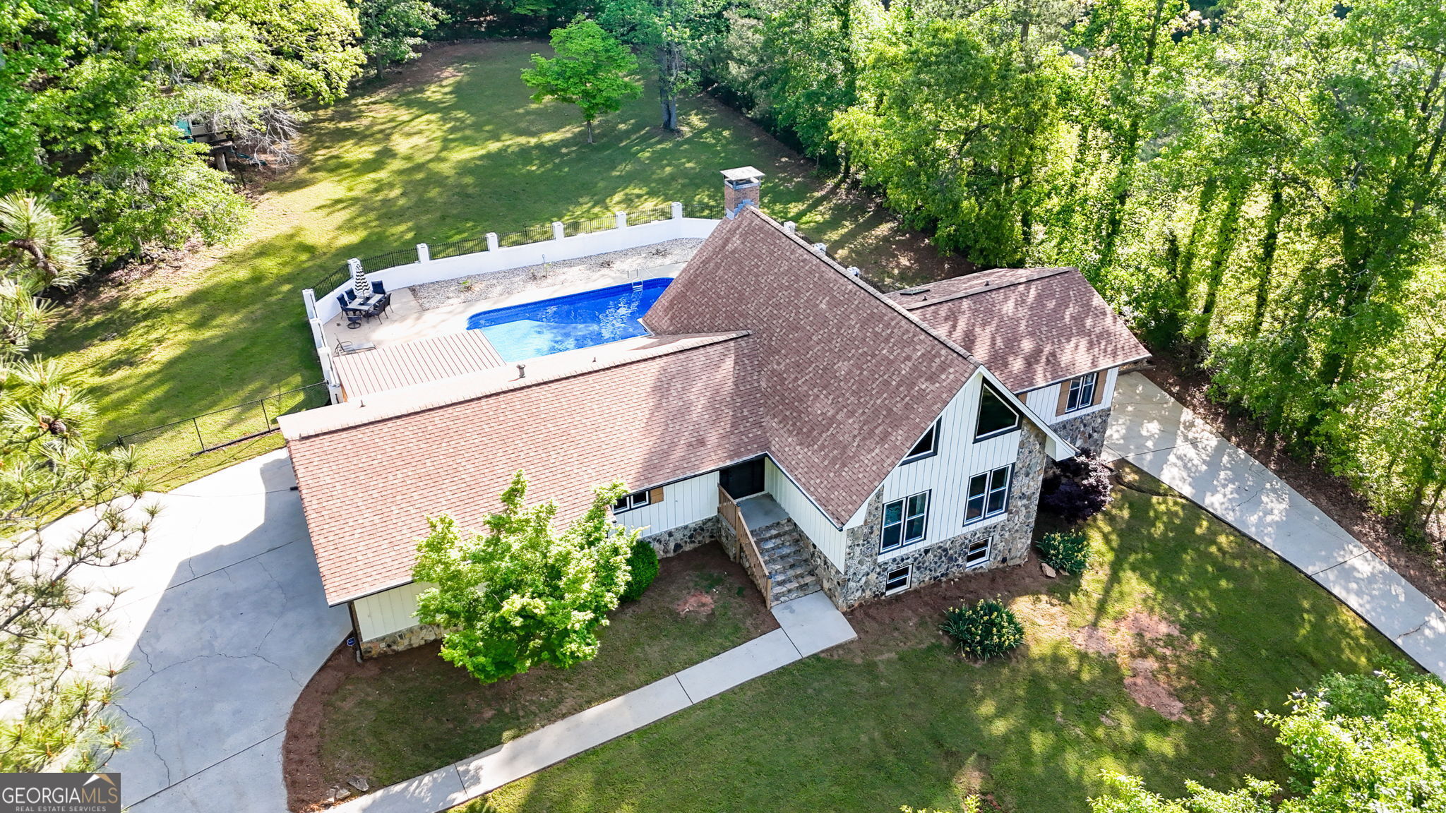 *** $7,000 BUYERS CONCESSIONS *** Lakefront Living with Pool, In-Law Suite & Boat Slip - Priced Below Appraisal - instant equity! Welcome to 3222 Bayview Drive, where every day feels like a vacation! This spacious home is packed with features and designed for easy entertaining, memory-making, and laid-back lake life. Inside, you'll love the open, sun-drenched floor plan that showcases beautiful lake views from multiple rooms. The kitchen features stainless steel appliances, a walk-in pantry, and flows seamlessly into the living and dining areas, all bathed in natural light. Upstairs, a huge loft offers flexible space for a bedroom, media room, home office, or play area. The terrace level in-law suite includes its own private entrance and garage, ideal for multigenerational living, guests, or even rental income potential. Step outside to your own private backyard oasis, complete with a sparkling pool, covered patio, and plenty of space to relax, grill, and entertain. Whether it's family fun or a gathering with friends, this backyard was made for making memories. Set on over an acre in a peaceful, established lakefront community, this home offers privacy, plus a deeded boat slip (#23) at Bay View Marina, so you can enjoy all that Lake Spivey has to offer: boating, fishing, and water sports galore! Conveniently located near shopping, dining, hospitals, major interstates, and the Atlanta airport. Schedule your private tour today and experience the ultimate Lake Spivey lifestyle