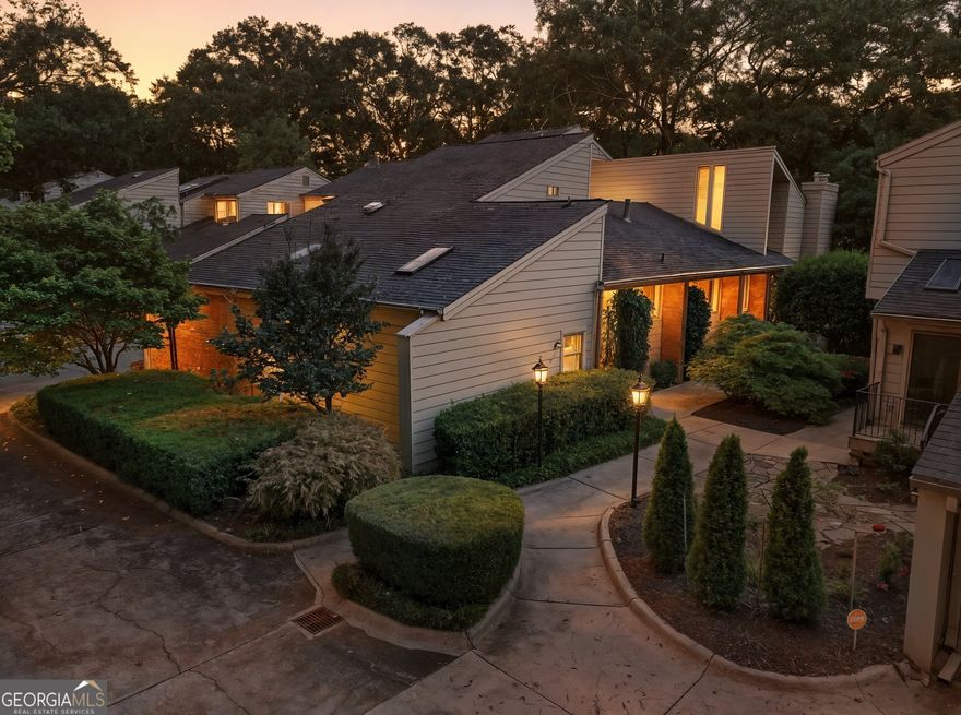 A million-dollar view for under a million! This one-of-a-kind Chattahoochee Riverfront home captures the perfect harmony of upscale design, prestige living, and effortless comfort without pretense. The wrap-around deck showcases some of the grandest river views you'll find anywhere.  The magic unfolds from the grand foyer, with its soaring vaulted ceiling and truly spectacular 8' tall double-door entry.  Walls of glass, soaring vaulted ceilings, and clerestory windows enhance the mid-century modern vibe as hardwood floors flow through the main level. This is one of only three homes in the community to feature a coveted main-level Master Suite.  With its secluded private entry, stunning river views, spa-like bath featuring twin vanities and oversize shower, it's the perfect waterside retreat at the end of the day. Of course, Bedroom Suite number two is equally large and opulent, offering serene comfort for guests and extended family, alike.  River views fill your attention from the massive, vaulted Living Room anchored by a dramatic floor-to-ceiling fireplace surround. The elegant Study brings to mind the quiet comfort of a classic British gentlemen's club. Nearby, a vaulted-ceiling Dining Room sets the stage for unforgettable dinner parties. For year-round indulgence, a glass-enclosed (even the ceiling is glass) multi-jetted hot tub creates a spa-like escape for relaxation or a therapeutic massage, regardless of the season.   "Chef's kitchen" perfectly describes the custom designed eat-in kitchen. Top-tier features include a tray ceiling, full-size paneled-front Sub-Zero refrigerator / freezer, Wolf cook top with both a griddle and a grill, topped by a Wolf range hood. There's also a Dacor wall oven/convection microwave combo, a 60" triple sink with commercial-grade faucet, triple-width window, luxurious cherry cabinetry including 2 appliance lifts, endless granite counter space, and a walk-in pantry. All the proper tools to excite the most discerning gourmand.  A few steps down from the kitchen, you'll find a massive (the only one in the community) multi-purpose laundry room with a whole wall of storage cabinetry and plenty of room for a workout area, too. Still need more storage space? The garage adds another wall of storage cabinetry along with under-stair space, yet still affords room for your vehicles. There's even a dedicated room for trash receptacles with convenient exterior and interior access!  But wait, there's more! Upstairs, Bedroom number three doubles as a private office complete with built-in cabinetry, half bath, and storage for all that other stuff you have to put somewhere. It even has its own HVAC system for all-season comfort. To simplify your busy life, the HOA maintains the roof, (Hardee) siding, exterior landscaping, exterior pest control and trash pickup.  River Place is conveniently located near fine dining, easy highway access, and endless recreational opportunities that include tubing, kayaking, and fishing. Outdoor activities like hiking and biking are available on the area's many trails, and you can also enjoy picnicking, wildlife viewing, and visiting parks like Don White Memorial Park and Morgan Falls Overlook Park. History buffs will love visiting the old paper mill ruins nearby.  Opportunities like this are rarely available-schedule your visit today and don't miss your chance to enjoy upscale riverside living at its finest!