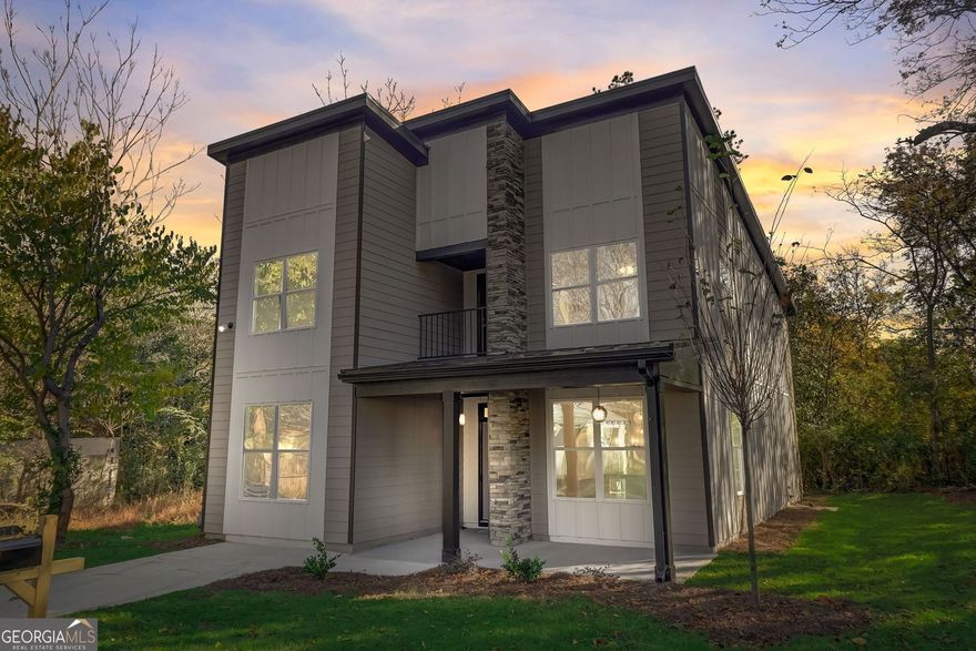 Welcome to 514 Cohen Street SW - a brand-new contemporary home that perfectly blends modern comfort with urban convenience in the fast-growing Pittsburgh neighborhood of Atlanta. This thoughtfully designed 4-bedroom, 3-bath home sits on a rare flat double lot, offering a spacious fenced front and side yard with plenty of room to relax, garden, or entertain outdoors. Step inside to an open floor plan where natural light flows easily from the dining area into the chef's kitchen and family room. The kitchen features a large quartz island, sleek cabinetry, and premium stainless-steel appliances soon to be installed. The family room is warm and welcoming with a cozy fireplace and direct access to a covered patio overlooking the private backyard - perfect for gatherings or quiet evenings at home. The main level includes a full bedroom and bath, offering flexibility for a guest room, home office, or creative space. Upstairs, you'll find the spacious owner's suite with a walk-in closet and a beautifully appointed en-suite bath designed for relaxation. Two additional bedrooms, another full bath, and a laundry room complete the upper level. This home includes modern features like a tankless water heater and security system. Enjoy the best of city living with proximity to Pittsburgh Yards, the BeltLine, Adair Park, Summerhill, Mercedes-Benz Stadium, and Downtown Atlanta, all just minutes away. Easy access to I-75/85 and I-20 makes commuting simple. A rare find in this historic area - a new construction with spacious flat yard, style, and comfort ready to welcome its new owners.