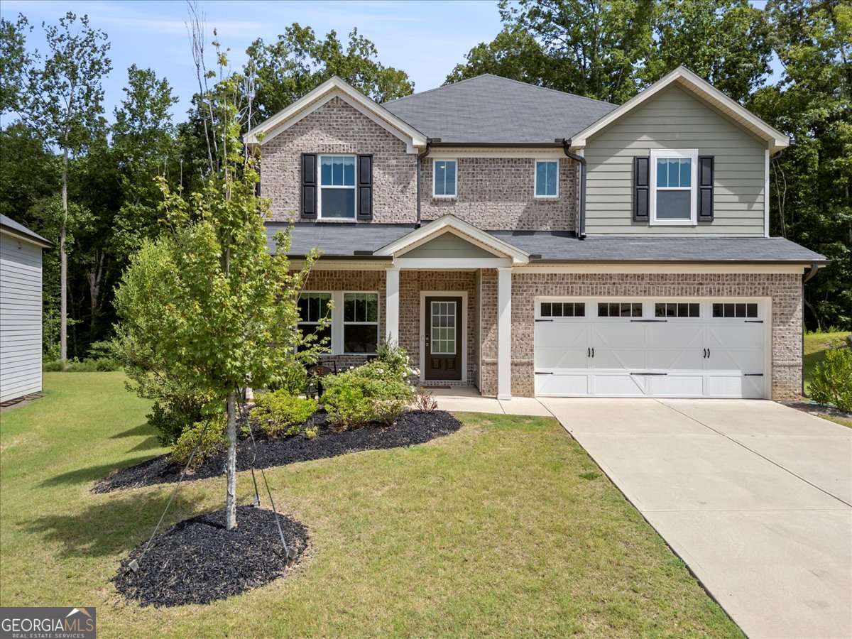 Welcome to 51 Longleaf Street - a spacious and beautifully maintained 5-bedroom, 3-bath home located in a highly desirable Dawsonville neighborhood! This home offers a flexible layout perfect for growing families, multi-generational living, or anyone who loves extra space. Enjoy an open-concept kitchen and living area ideal for entertaining, along with a full bedroom and bathroom on the main level. The upstairs features a generous owner's suite, plus three additional bedrooms and a full bath. Situated just minutes from the North Georgia Premium Outlets, dining, and top-rated schools, this home combines comfort, convenience, and location. Don't miss your chance to own this gem in the heart of Dawsonville!