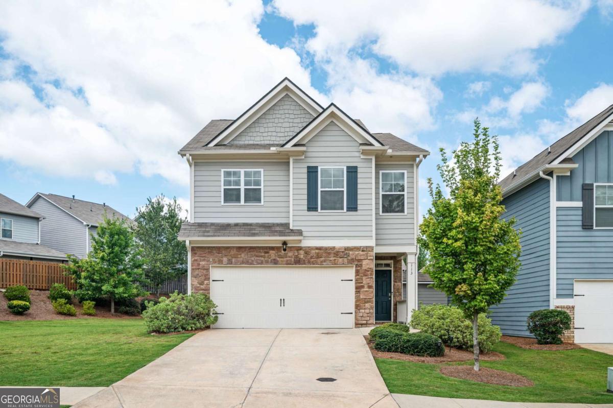 Located in an unincorporated part of Cherokee County and close to both I-75 and I-575, this Acworth home conveniently sits between Downtown Acworth and Woodstock, and is convenient to shopping and award-winning schools. Upon entering this adorable home, you'll notice the home's pristine, move-in ready condition and wonderful daylight spilling in through the windows. This floor plan allows for easy entertaining with a nice flow and open concept on the main level. The updated kitchen boasts white cabinets, granite counters, a lovely kitchen island, and pantry. After a long day's work, curl up next to your gas log fireplace with a good book and a cup of coffee, or retreat upstairs to soak in your spa-like tub. The primary bedroom and bath boast tray ceilings with dual vanities and a separate tub and shower. The three secondary bedrooms are spacious and neat. The level backyard has a huge side yard, a patio, a storage closet, and tons of yard to toss a ball to your furry friend, play cornhole, or run amok! It's one of the larger lots in the neighborhood! Think of all the cook-outs you'll have! The HOA maintains the lawn, so you'll have more free time for fun! This home has been pet and smoke free, and faces South.