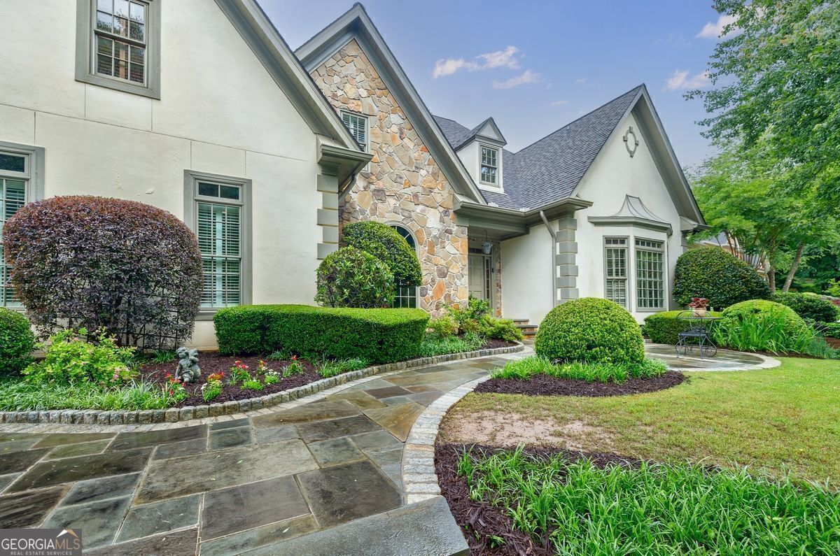 A Price Refresh! European Charm in Coveted Brooke Farm - Dunwoody Living at Its Finest! Welcome to Brooke Farm, one of Dunwoody's most vibrant and established communities! This 6-bedroom, 4.5-bathroom masterpiece has been lovingly maintained and thoughtfully designed-offering luxury, space, and an entertainer's dream backyard. Before we step inside, a word about the backyard oasis-truly a 10 out of 10. Imagine hosting friends and family in your private retreat featuring a spa, outdoor fireplace, charming gazebo, bocce ball court, and lush, professional landscaping. Fire up the built-in grill, gather under the stars, and enjoy the seamless blend of relaxation and recreation. Inside, you're welcomed by a light-filled two-story foyer that opens to a dramatic great room. The kitchen and adjacent sitting area offer a warm, open space to unwind while enjoying picturesque views of your stunning yard. The main level also boasts a spacious primary suite, a formal dining room perfect for holidays, and a cozy library/office with its own fireplace. Upstairs, discover four generously-sized bedrooms and two full bathrooms, providing comfort and privacy for everyone. And yes-there's more! The terrace level is a true extension of your living space, featuring a family room with fireplace, bar/kitchenette, an additional office, bedroom, full bath, and a dedicated work/tool room. Brooke Farm offers a swimming complex with a Junior Olympic pool, an adults-only pool, a baby or toddler pool, a covered pavilion and a pool house with bathrooms and showers. There are 4 tennis courts and a viewing stand. In addition, the community contains a lake offering fishing. Brooke Farm is a beautiful, established neighborhood close to all the richness that Dunwoody has to offer!