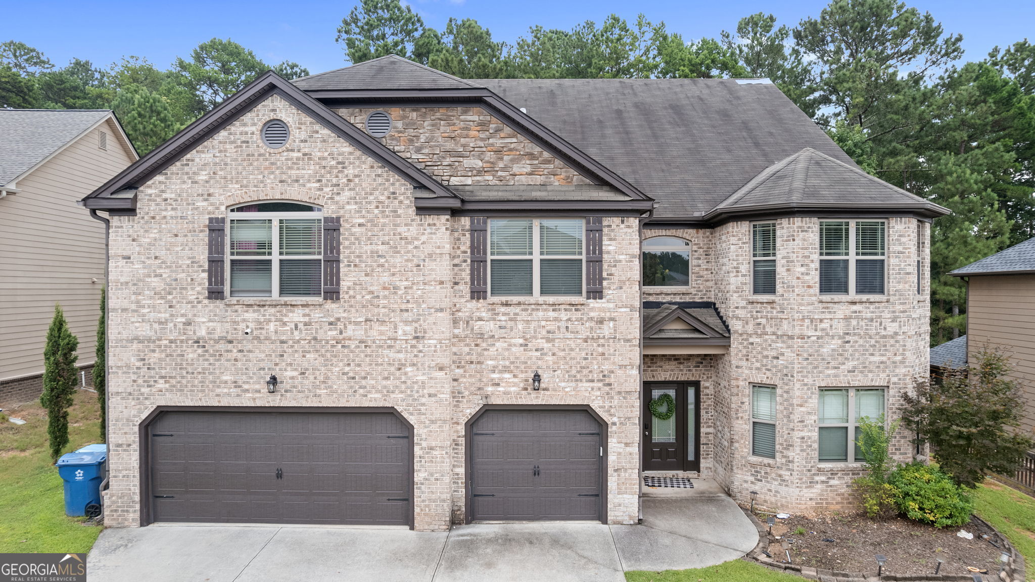 Welcome to the largest floor plan in the Austin Commons subdivision. This house is the perfect example of having both quiet and accessibility. Walking in you will be greeted with an open style living room with vaulted ceilings and cozy fireplace, kitchen with ample cabinet space, along with the formal adjoining dining room. There are no shortage of bedrooms here, with all 6 having their own walk-in closets. This amazing home has the luxury of being minutes away from shopping and Publix, while also being approximately 20 minutes from Snellville and Lawrenceville. Further noting its an easy 1 hour drive to the ATL airport. Don't miss this opportunity to experience where luxury, tranquility, and accessibility come together to make the best home for you!