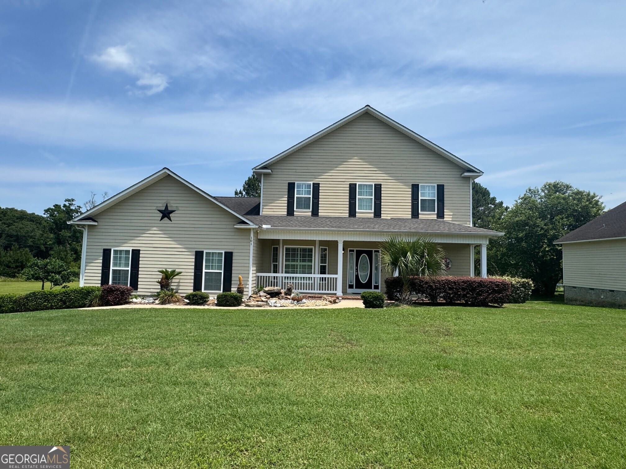 Discover your dream home nestled on a sprawling 4.27 acres of serene countryside! This stunning 4-bedroom, 3.5-bath boasts 3,730 sq. ft. under roof of living space, featuring an ideal layout with two primary bedrooms-one conveniently located on the main floor and the other upstairs, complete with its own full bath. Kitchen includes center bar, stainless steel appliances, and plenty of cabinets and formal dining room. Small desk space, ideal for a home office or study nook. Enjoy the seamless blend of indoor and outdoor living with a spacious screened patio and a large, covered porch, perfect for relaxing or entertaining while taking in the picturesque views of your private pond with dock. Additional highlights include a two-car garage with ample storage, a comprehensive security system and meticulously maintained landscaping that enhances the home's curb appeal. This property offers limitless outdoor space, making it perfect for gardening, recreation, or simply enjoying the tranquility of nature. Schedule your showing today and experience the perfect blend of comfort and nature!