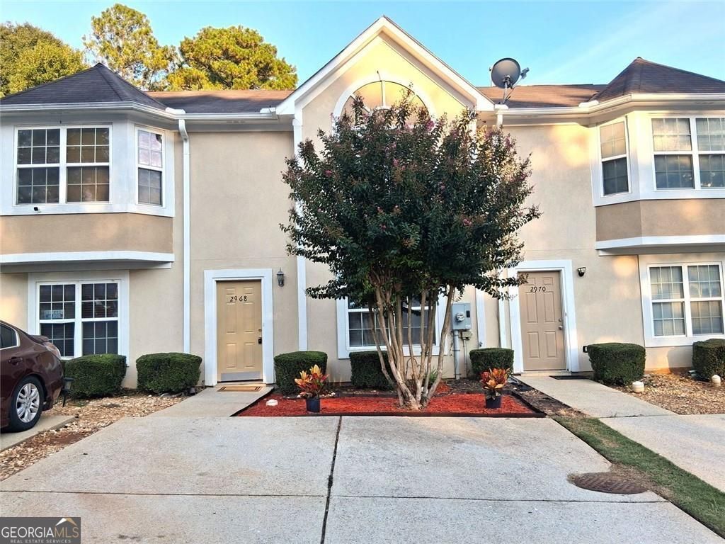 Welcome to this beautiful 3-bedroom, 2.5-bath fee simple townhome offering 1,212 square feet of comfortable living space. Pull up to the warm curb appeal onto the private 2 car parking pad. Enter the foyer, inviting you into the bright spacious living room and a fully equipped kitchen with all appliances including washer/dryer for your convenience-perfect for everyday living and entertaining. Upstairs, you'll find a large primary suite complete with a private bathroom and walk in closet, while two additional guest bedrooms offer ample natural light and generous closet space. Step outside to enjoy a private backyard patio-ideal for relaxing or hosting guests. Additional highlights include low-maintenance living with HOA dues covering ground maintenance & exterior painting. Conveniently located near major interstates and shopping. This home offers both comfort and convenience. Freshly painted with clean carpet throughout, it's move-in ready. Don't miss out on this fantastic opportunity-schedule your showing today!