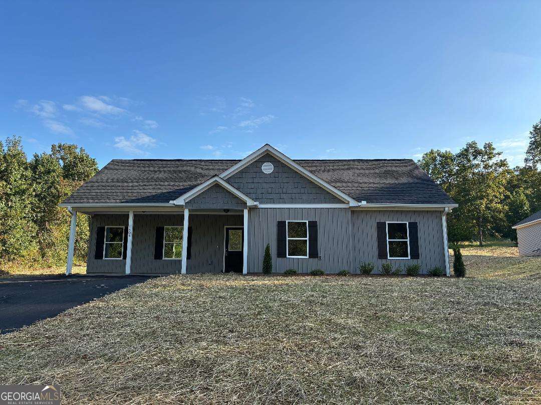 QUALITY NEW CONSTRUCTION ON THIS STEP LESS 3/2 VINYL RANCH ON 1 ACRE LOT JUST MINUTES FROM GA. 400, DAHLONEGA, MURRAYVILLE, CLEVELAND AND GAINESVILLE. SPACIOUS KITCHEN WITH OVERSIZED GRANITE ISLAND WITH VIEW TO VAULTED GREAT ROOM PERFECT FOR ENJOYING YOUR FAMILY OR ENTERTAINING, SOFT CLOSE WHITE CABINETS AND GE STAINLESS APPLIANCES INCLUDING SIDE BY SIDE REFRIGERATOR, FARMHOUSE SINK, PANTRY. QUALITY LUXURY VINYL THRU OUT FOR EASY MAINTENANCE, BRIGHT, LIGHT AND AIRY. MASTER HAS TREY CEILING, WALK IN CLOSET AND DOUBLE VANITY. TOTAL ELECTRIC, $45 PER MONTH FOR PRIVATE WATER, TERMITE BOND AND BUILDER"S WARRANTY, NO RENT RESTRICTIONS. PROPERTY WAS SUBDIVIDED THIS YEAR AND TAXES TO BE DETERMINED BY LUMPKIN COUNTY TAX COMMISSIONER'S OFFICE