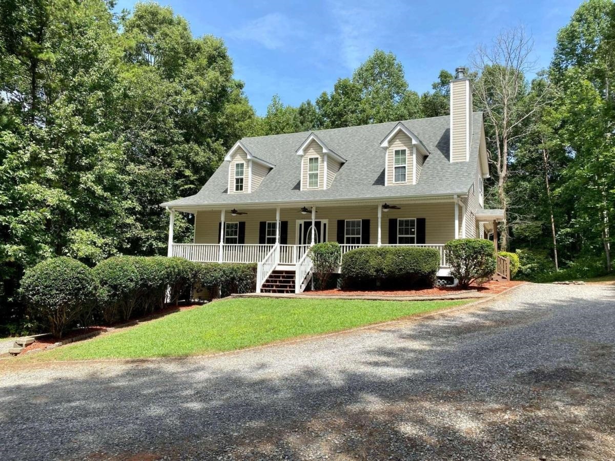 Awesome location near all the new retail in Dawsonville! Total of 4.536 Private Acres w/beautiful, move-in ready home! New carpet/pad thruout & new interior/exterior paint. Fantastic chefGÇÖs kitchen w/SubZero frig/freezer, tons of gorgeous custom stained cabinetry & lots of solid surface counters, Mud Rm w/laundry sink, Family Rm w/wood burning stove, Owners Suite on main level plus private deck viewing the wooded backyard. Spacious Breakfast area has direct access to oversized covered deck w/tv, surround sound & fansGǪperfect for Bulldawg season coming up soon!Upper level has nifty loft area great for teen rec space or whatever you can think of. 3 Bedrooms, all with walk in closets & 2 full baths. Great set up! Neat computer space w/game or tech closet close by. Full unfinished basement w/stubbed bath, floors & concrete walls have just been sealed/painted. Looks very clean! 15'x15' room w/vault door for valuables is very cool & different! Direct basement access on left side of home but of course there is interior entry as well. On survey, Lot 1B can accommodate a mobile home. Ask agent for more details. Would be great spot for rental property.