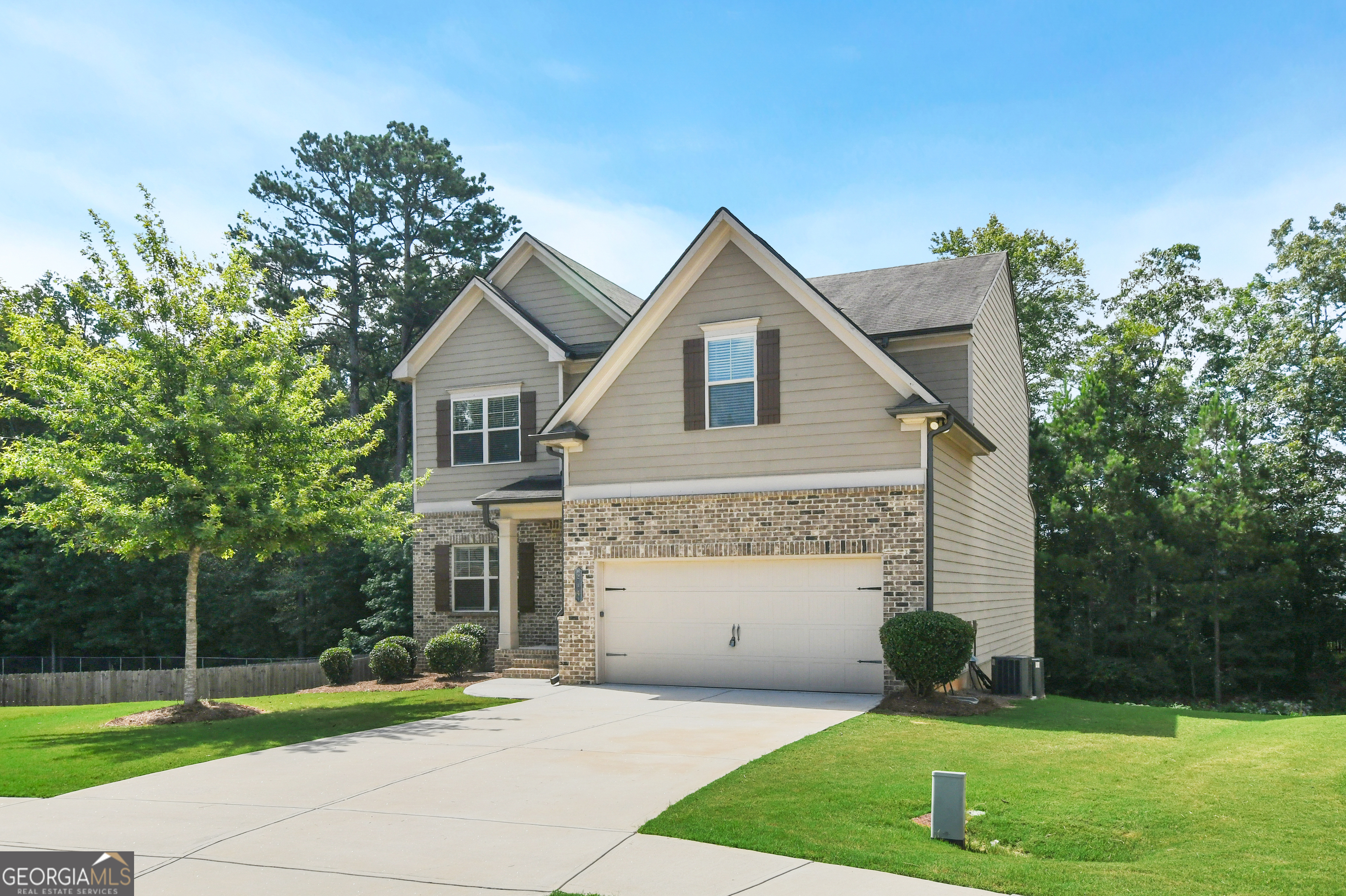 Spacious 5-Bedroom Home with Finished Basement in Walton County - 214 Jacobs Court, Loganville, GA Welcome to 214 Jacobs Court, a stunning 5 bed / 3.5 bath home located in a quiet cul-de-sac in Loganville, GA-zoned for Bay Creek Elementary, Loganville Middle, and Loganville High School in sought-after Walton County. With over 4,200 sq ft of space (2,641 finished sq ft and a 1,576 sq ft unfinished basement), this 3-story home offers plenty of room for living, entertaining, and future expansion. The charming brick and wood siding exterior, covered front porch, and expansive back patio off the dining room create the perfect setting for gatherings. Inside, you'll find a well-appointed layout with a large open-concept kitchen featuring stainless steel appliances and ample cabinet space. A coat area by the interior garage door adds function and convenience. The main level includes a separate dining room, a bonus room, and a spacious living room with a cozy fireplace. The primary suite offers double walk-in closets, tray ceilings, and a luxurious en-suite bath with double sinks, a separate shower and soaking tub, and a window that brings in natural light for ultimate relaxation. Choose to enjoy the master on the main or upstairs for flexibility. Upstairs bathrooms are designed for comfort with double vanities, while a half-bath on the main level is perfect for guests. Additional features include: 5 bedrooms / 3 full baths / 1 half bath 2-car garage with driveway Shared mailboxes within the cul-de-sac Community playground within walking distance Unfinished basement for storage or expansion Tray ceilings and architectural accents throughout This home offers space, style, and a great location-perfect for families looking to settle into a vibrant Loganville community.