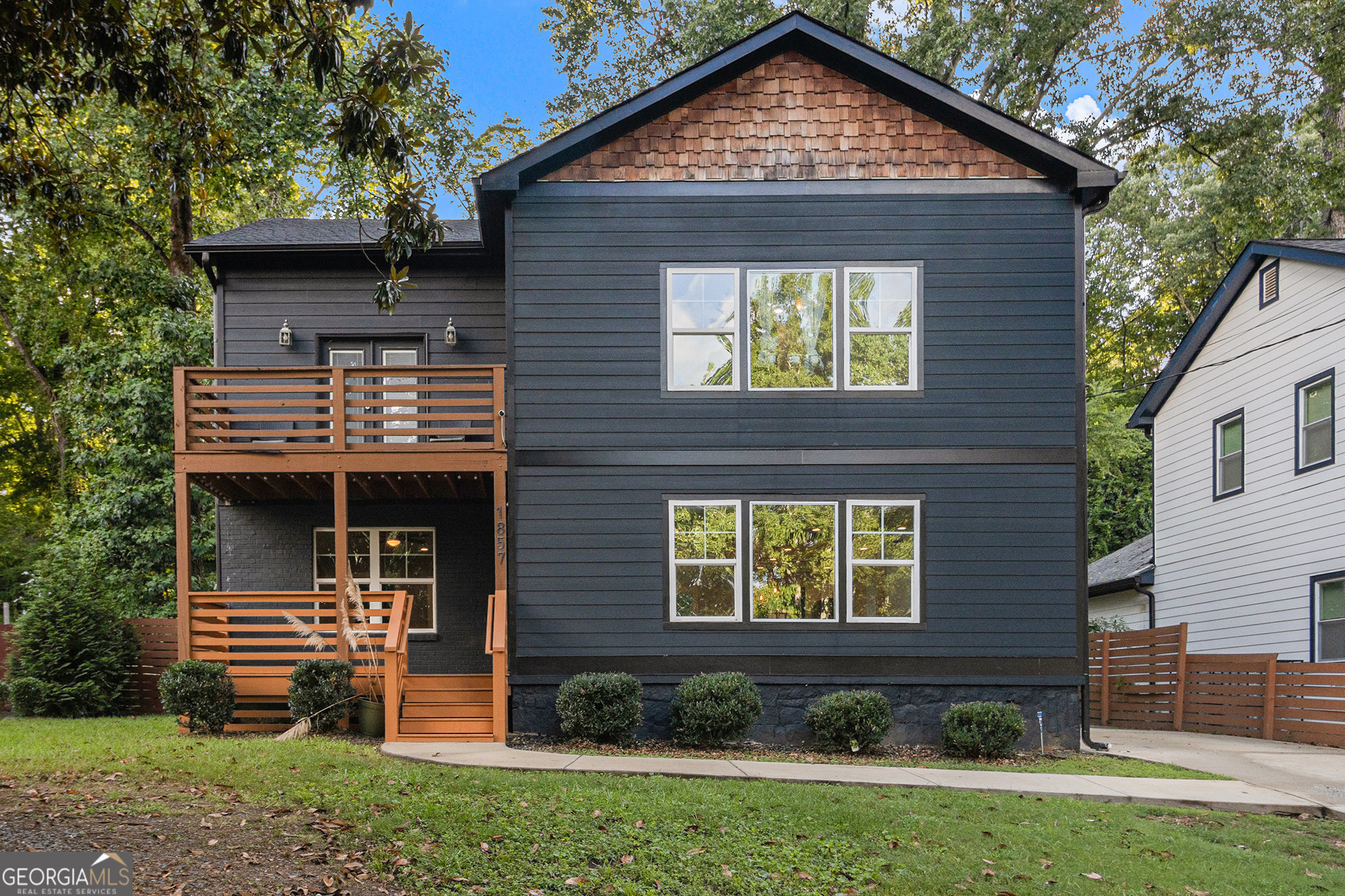 Beautifully remodeled 4BD/3BA home in one of Decatur's most desirable neighborhoods! Fully renovated in 2019, this home features a beautifully designed open-concept main level flooded with natural light, real hardwood floors throughout (no carpet!), and a generously sized bedroom and bath on the main level. The chef's kitchen includes granite countertops, pressed porcelain tile, and a gas range overlooking the living and dining areas. Upstairs, enjoy 10' ceilings, two spacious secondary bedrooms, and a luxurious primary suite with oversized walk-in closet, spa-inspired bath, and access to a shared balcony overlooking the backyard. All bathrooms feature elegant tile. Great location- just minutes from Downtown Atlanta and I-20, and walking distance to Shoal Creek Park- a beautiful community green space with a playground and more!